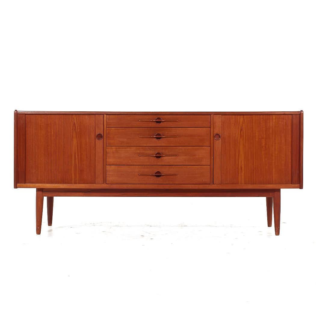 Harry Ostergaard for Randers Mobelfabrik Mid Century Teak Tambour Door Credenza

This credenza measures: 72 wide x 19 deep x 31.75 inches high

All pieces of furniture can be had in what we call restored vintage condition. That means the piece is