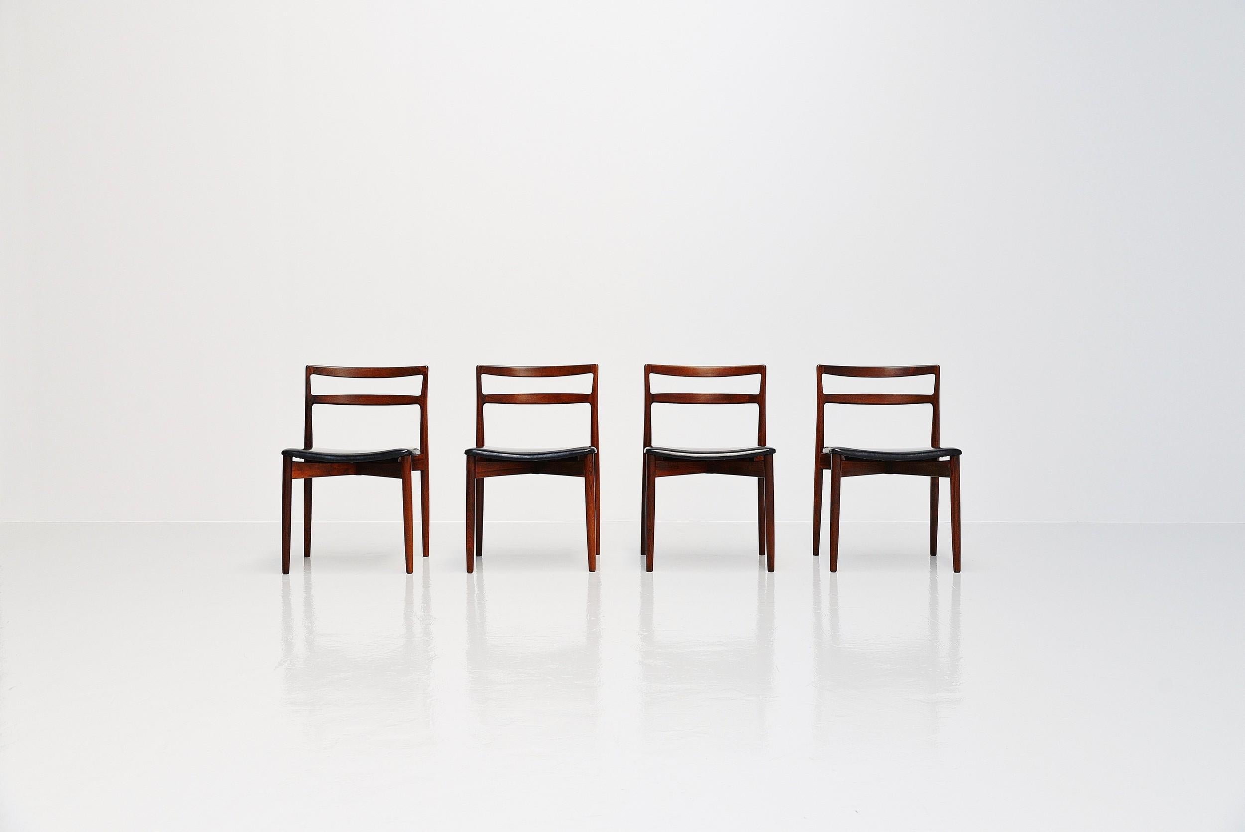 Fantastic set of 4 dining chairs model 61 designed by Harry Ostergaard and manufactured by Randers Mobelfabrik, Denmark 1961. The chairs have very nice charactaristic, typical Danish modern features. The beautiful rosewood with dark flames in it,