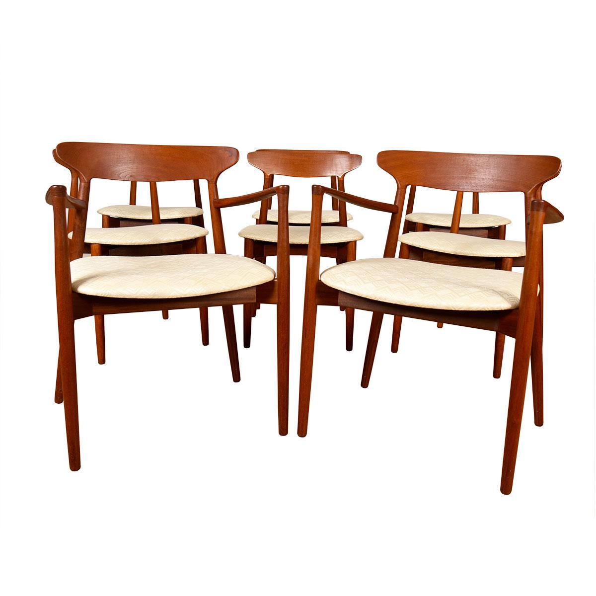 Solid teak sculpted backrests define these chairs — in stunning vintage condition.
Designed by Harry Ostergaard, the iconic mid century designer and one of the leaders  of the Danish Modern furniture movement.
Set includes the 2 hard to come by arm