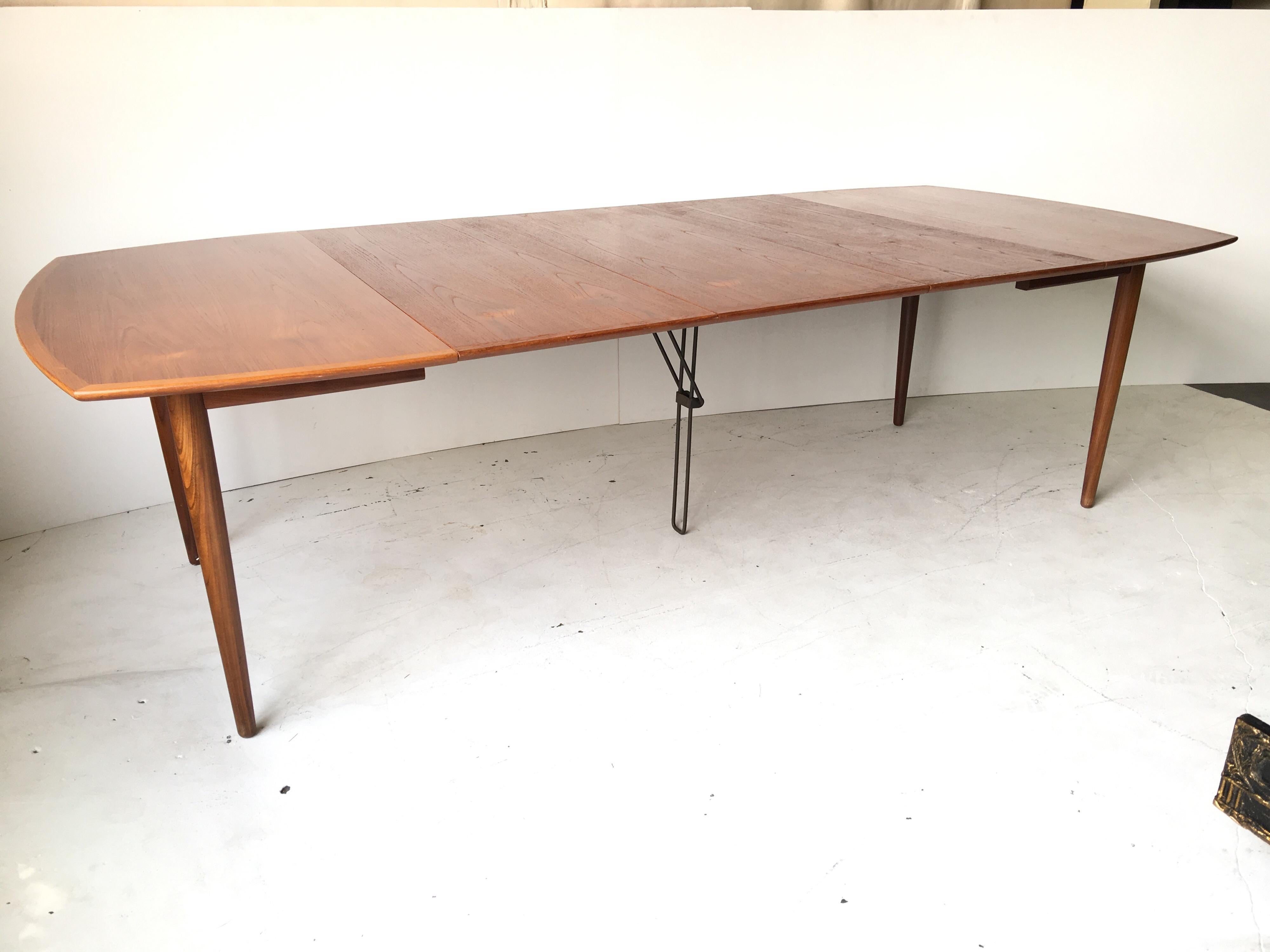 This comes from original owner estate, and was set up for seating for 10 people. It is a vintage 1960 Danish modern teak dining extension table for Randers Mobelfabrik, Denmark, by Harry Ostergaard. I have the chairs for sale separately that have