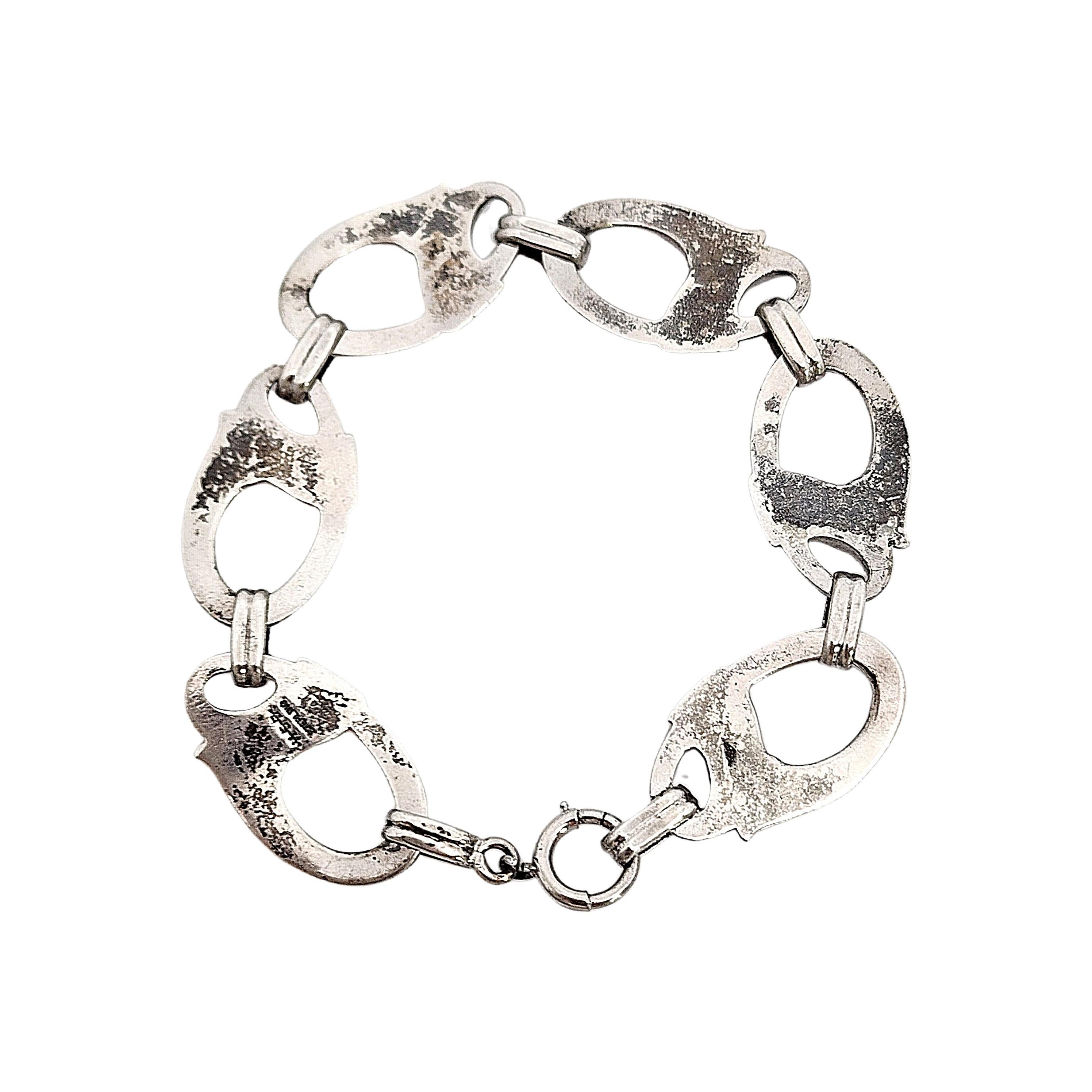 Harry S. Bick sterling silver swirl link bracelet.

Beautiful Art Deco piece featuring large oval swirl/flourish links.

Measures approx 7