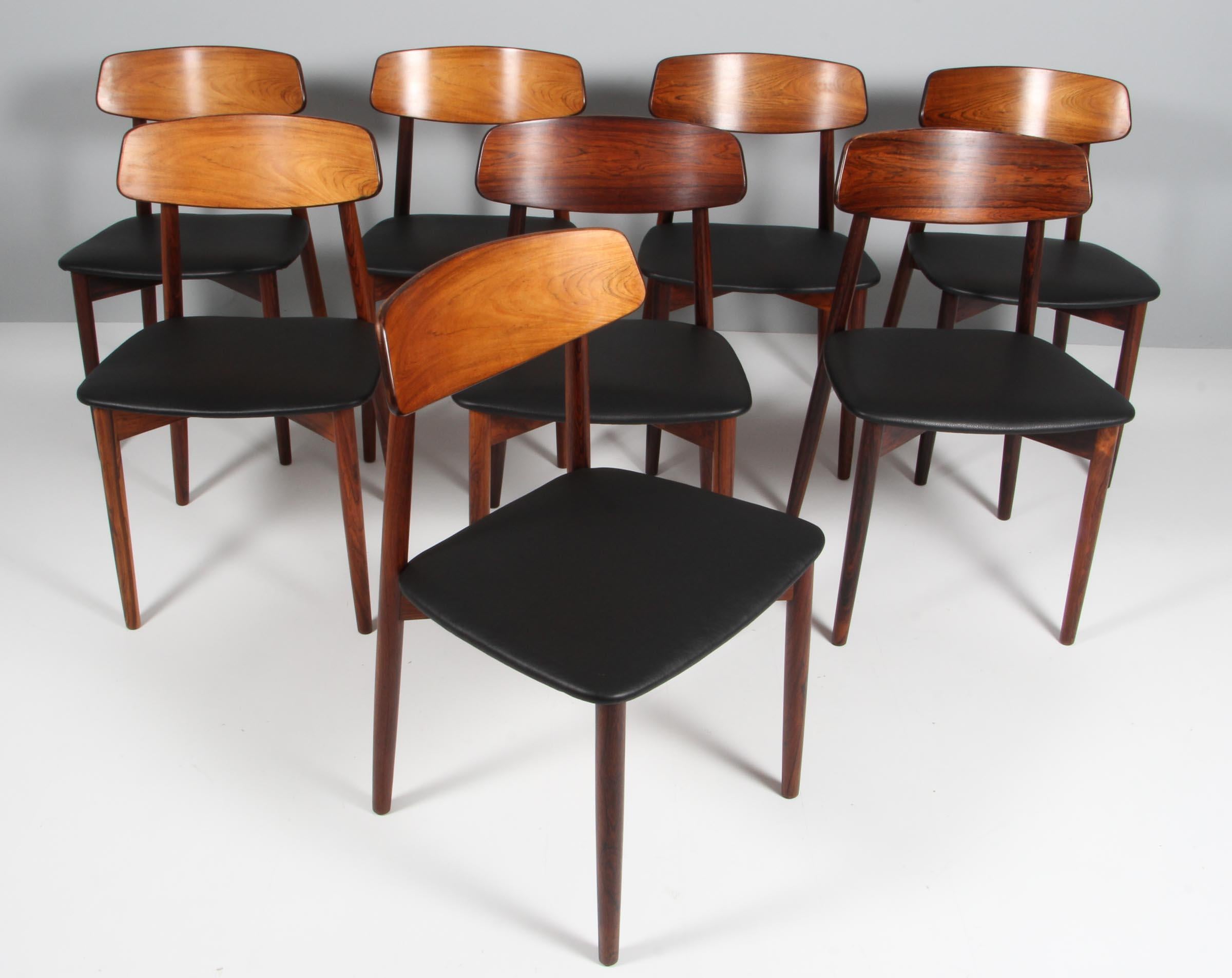 Harry Østergaard eight dining chairs in rosewood.

New upholstered with black aniline leather.

Made by Randers Møbelfabrik, 1970s.


