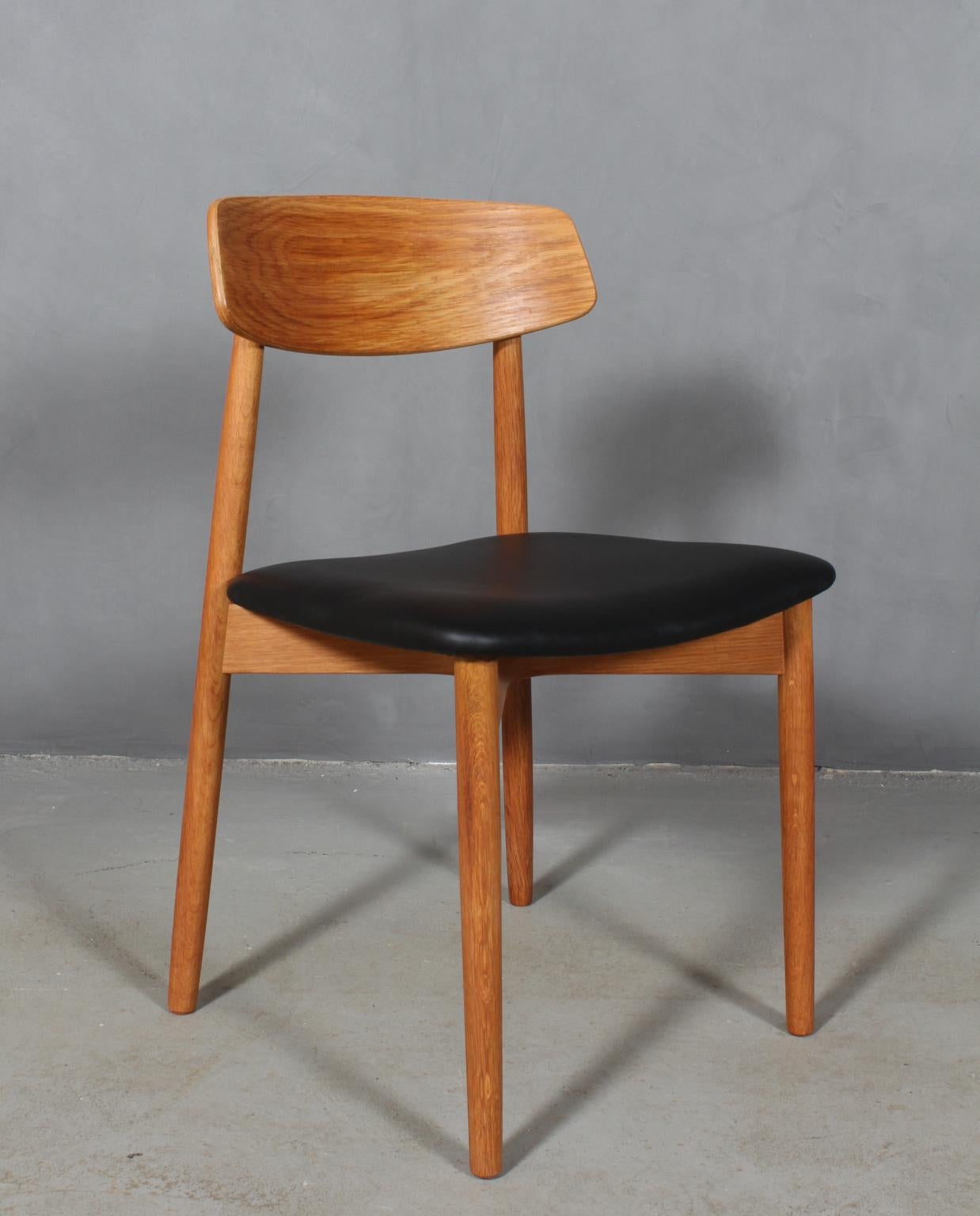 Danish Harry Østergaard, Four Chairs in Oak and Black Leather, 1970s