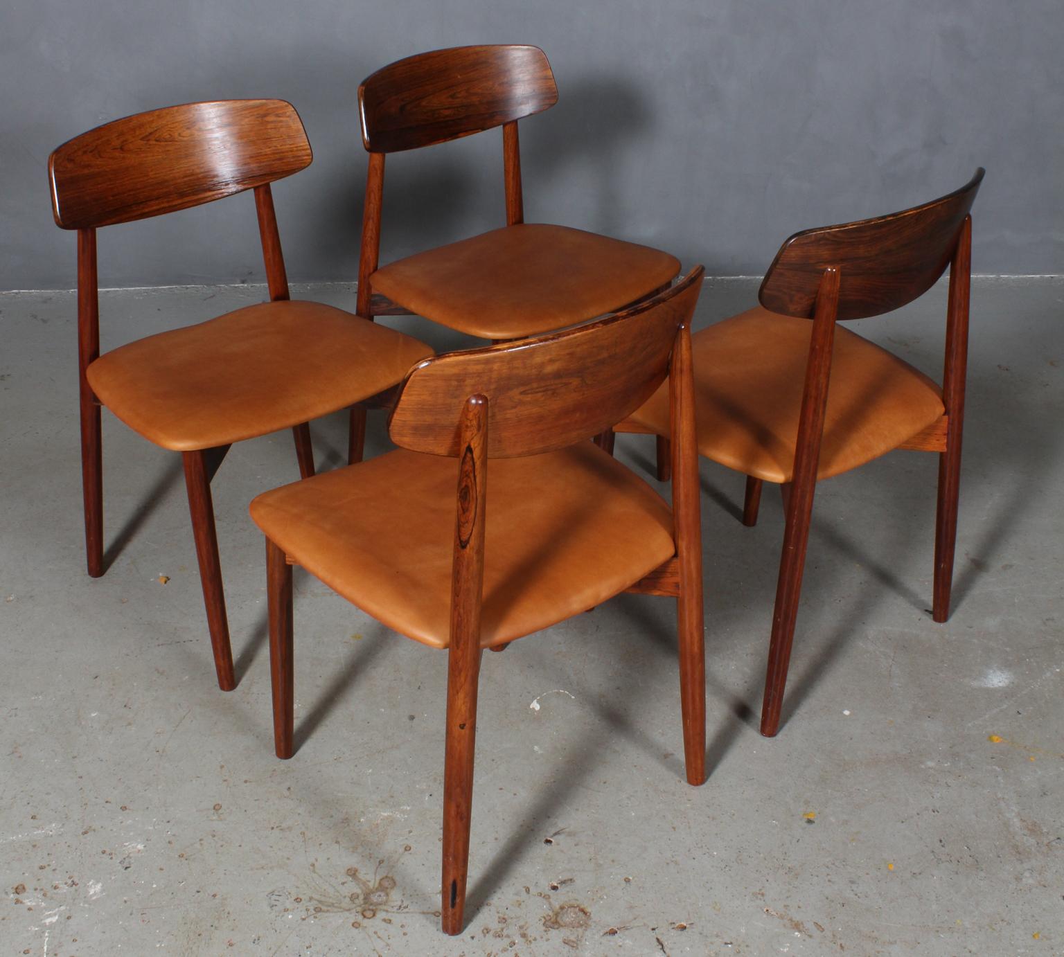 Harry Østergaard four dining chairs in rosewood.

New upholstered with tan aniline leather.

Made by Randers Møbelfabrik, 1970s.


 