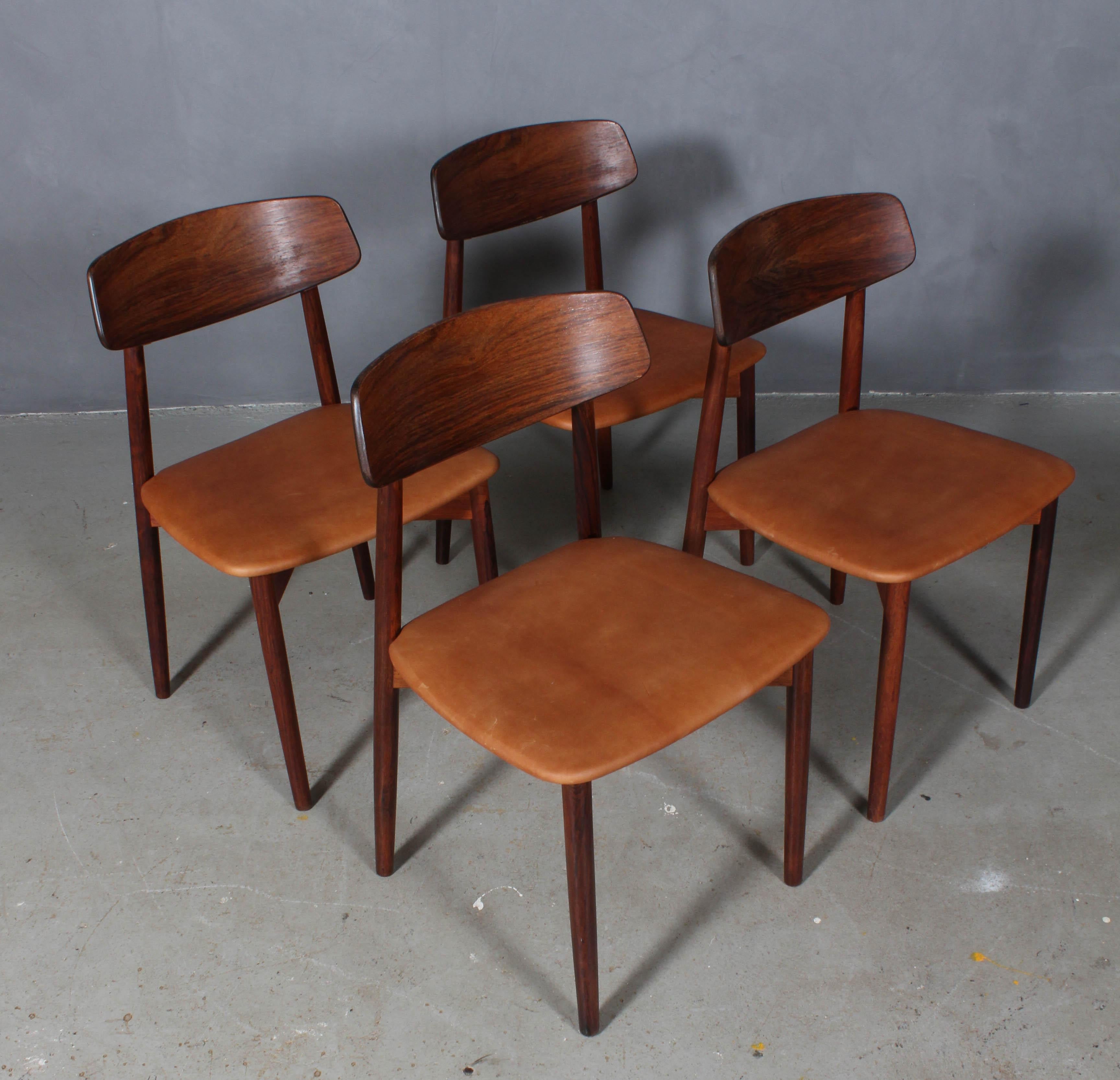 Harry Østergaard four dining chairs in rosewood.

New upholstered with tan aniline leather.

Made by Randers Møbelfabrik, 1970s.


 