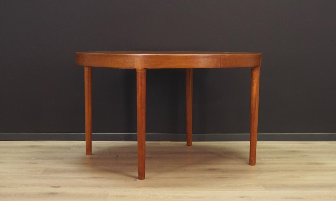 A unique table from the 1960s-1970s, designed by leading Danish designer Harry Østergaard and manufactured by Randers Møbelfabrik. Tabletop finished with teak veneer, legs made of solid teak wood. The table has two inserts to increase the surface