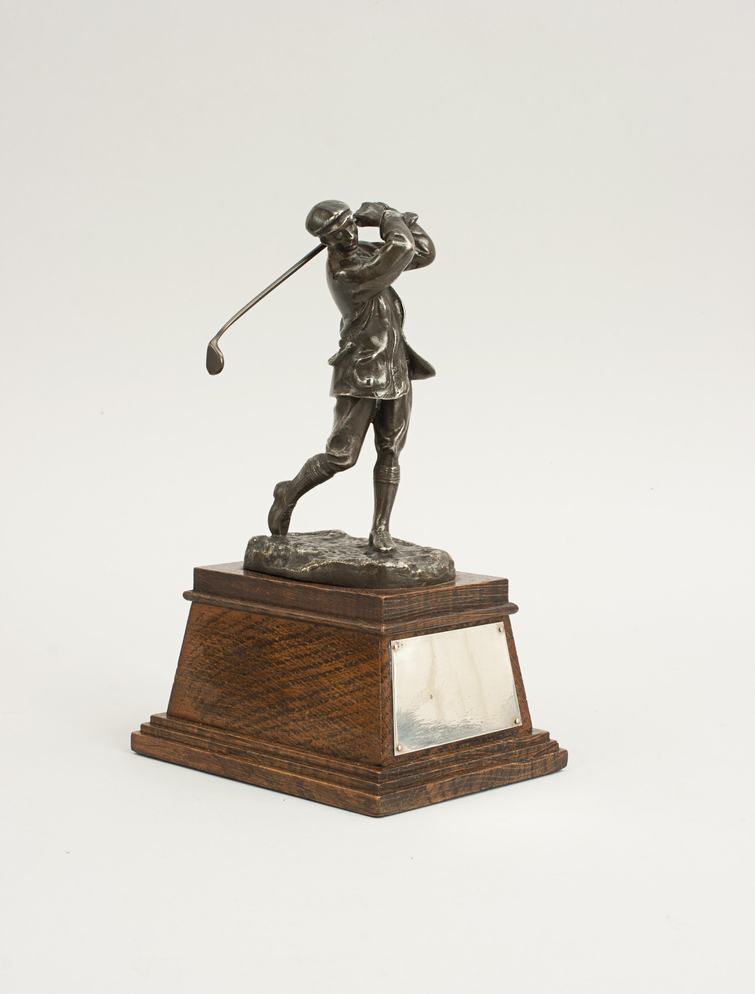 Golf Figure of Harry Vardon.
A wonderful cast figure of the Champion Golfer Harry Vardon. The figure was sculpted by Hal Ludlow and cast by the Elkington foundry. The impressive and well-known figure of Vardon is mounted on an oak plinth with