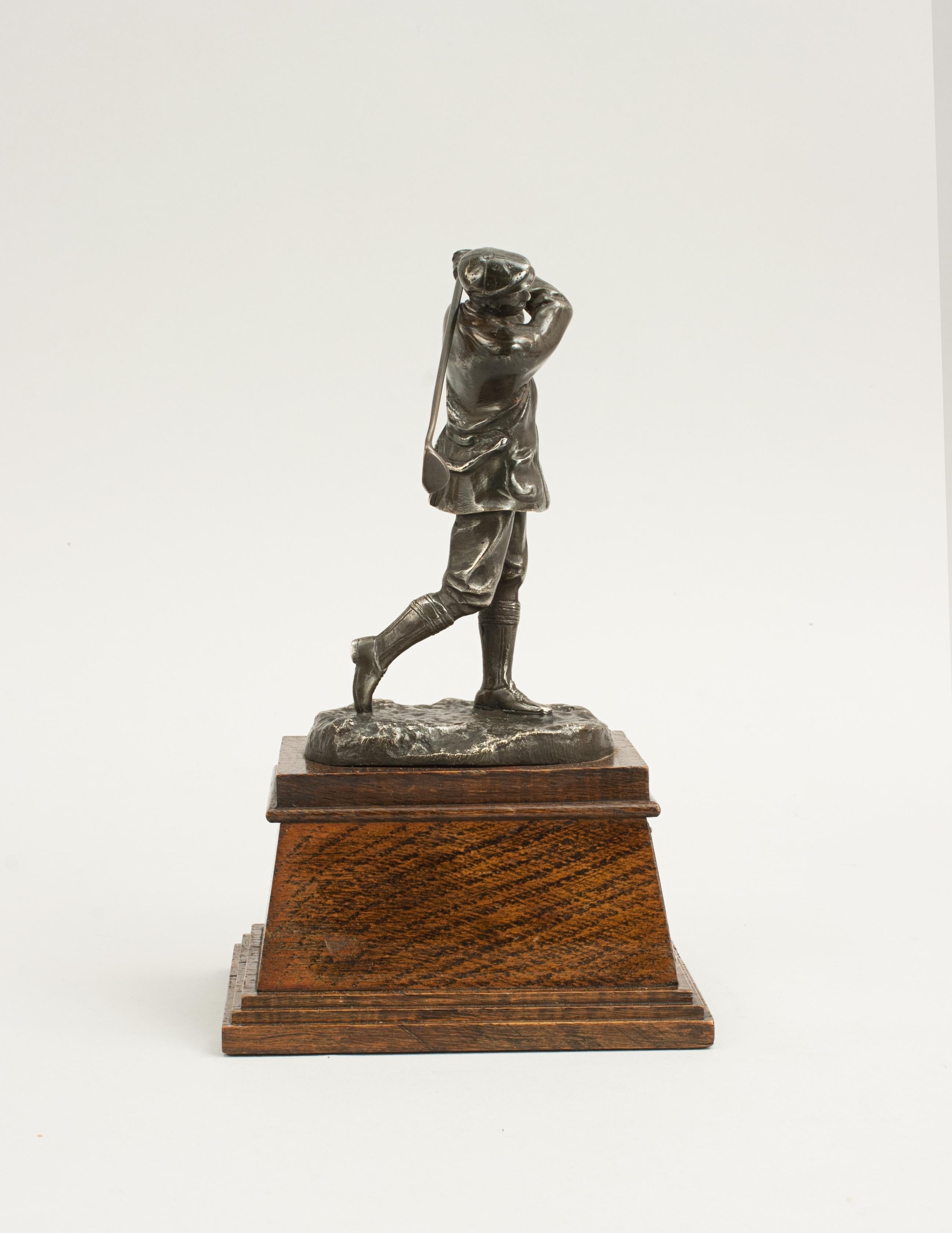 bronze golfer statue
