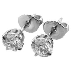 Harry Winston 0.59 and 0.50 Carat Solitaire Round Diamonds Earrings