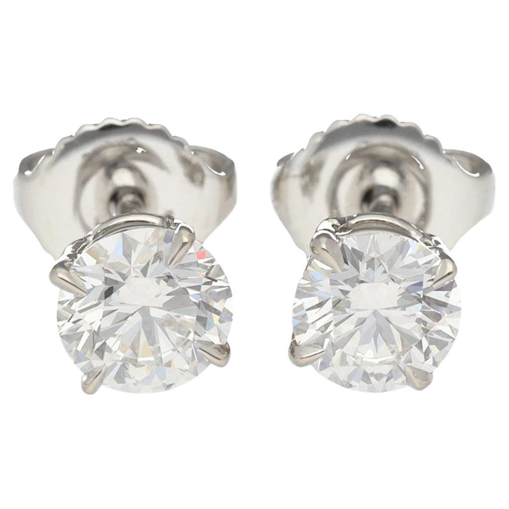 Harry Winston 0,59 ct / 0,50 ct Pt950 Solitario taglio rotondo con orecchini a spillo
