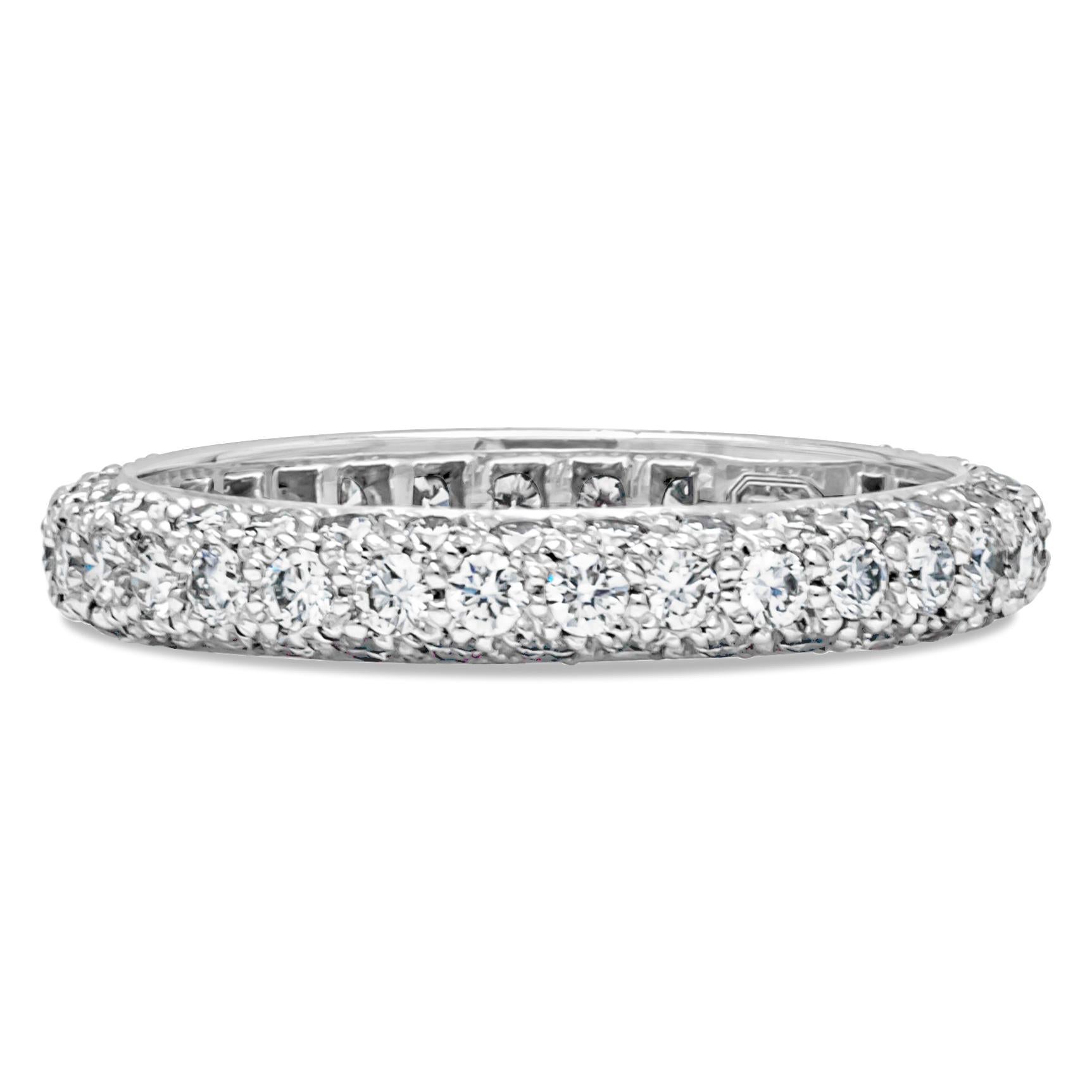 A classic diamond eternity wedding band by Harry Winston, showcasing a multi-row circle of 99 round brilliant cut diamonds weighing 1.08 carats total with D-E-F color and VS clarity. Set on a micro-pavé dome platinum, 3 mm in width. Size 5 US,