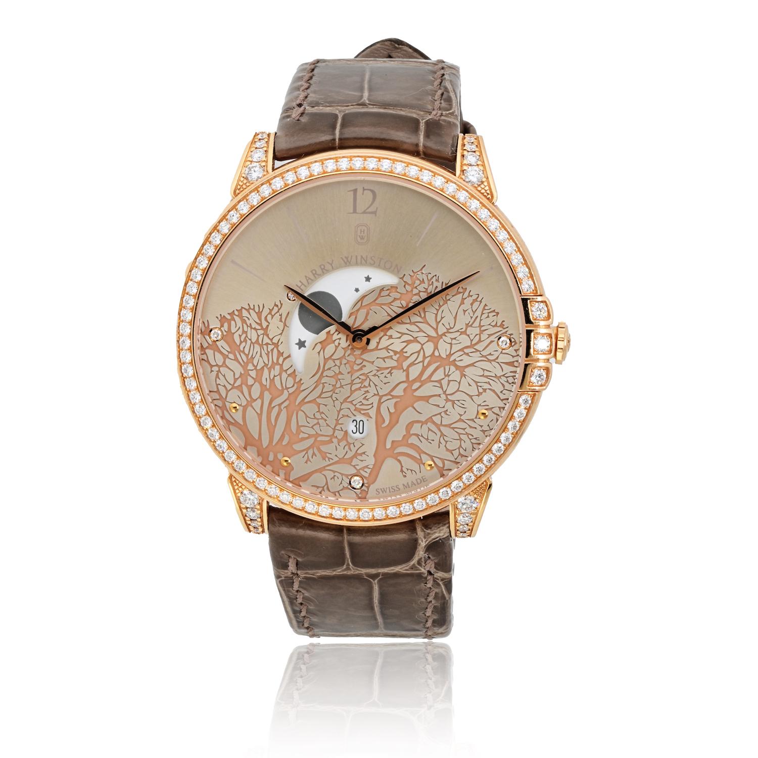 This exquisite timepiece, crafted from 18kt rose gold, embodies timeless elegance. The 39 mm round case, embellished with 0.96 ct of sparkling diamonds, features a fixed diamond-set bezel that perfectly complements the satin strap. The champagne