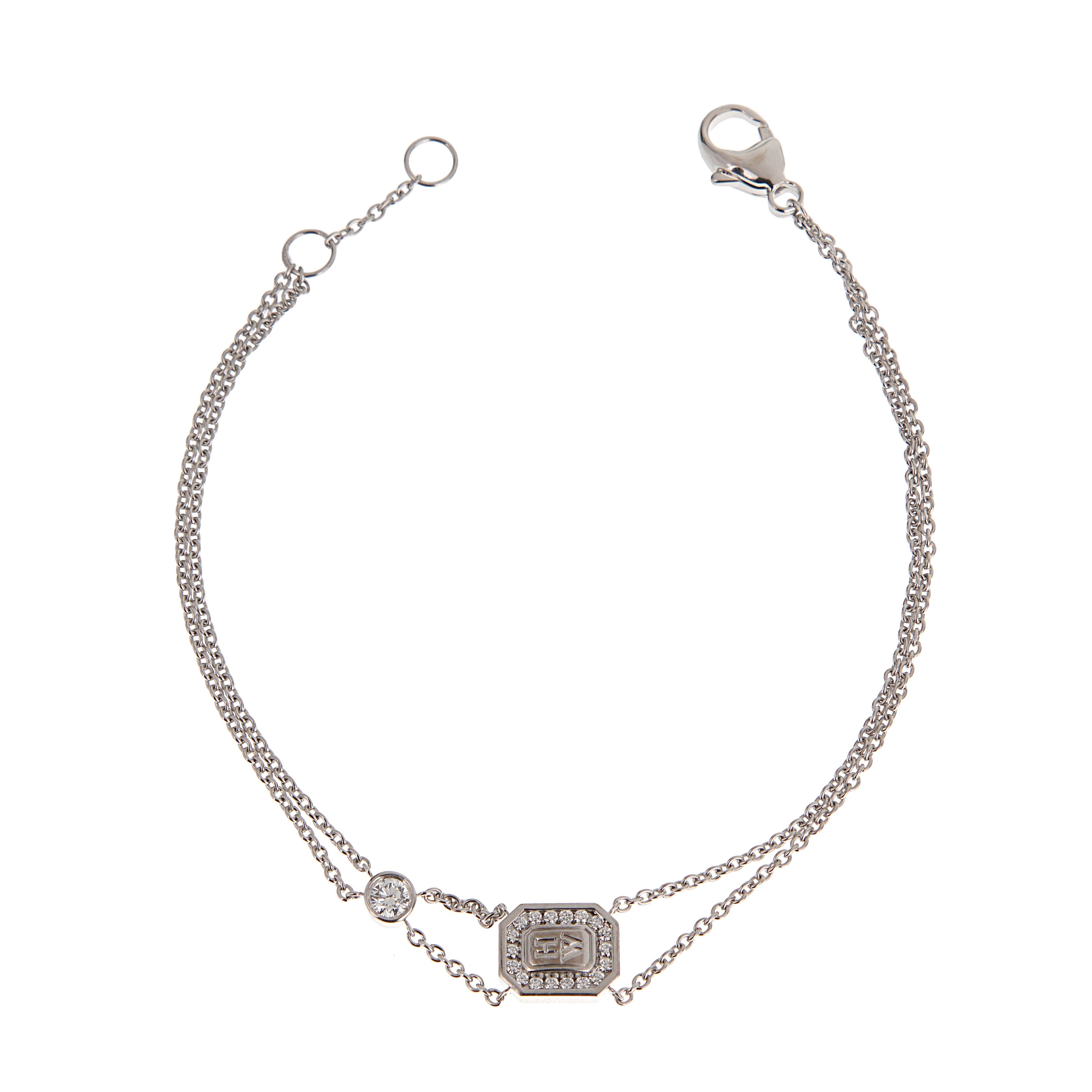 Le bracelet Harry Winston en or blanc 18 carats à chaîne de diamants est l'expression raffinée de l'élégance moderne et du luxe intemporel. Il arbore le logo emblématique de la Maison, encadré de diamants taille brillant, avec un seul diamant serti