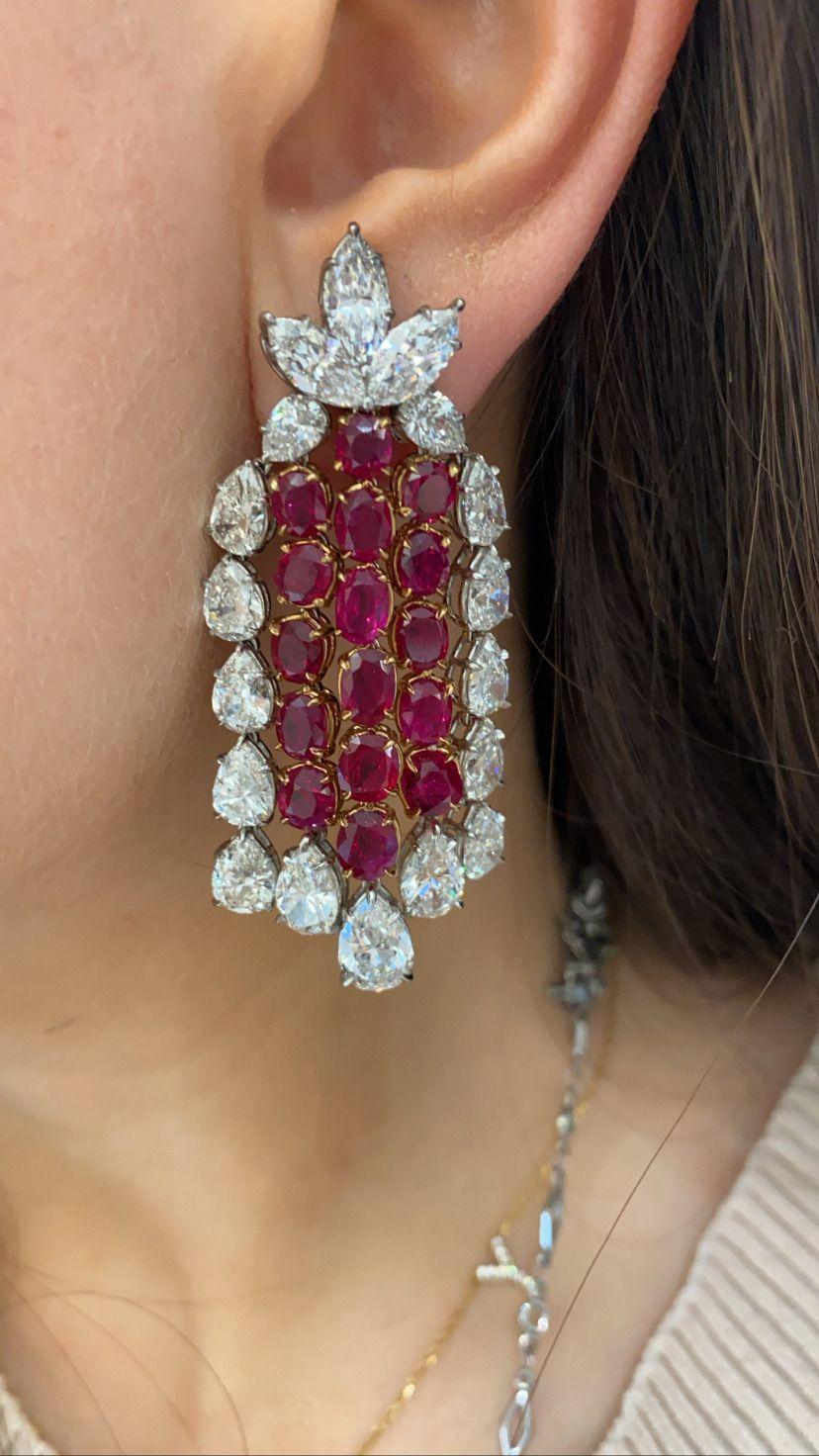 This One of a kind Harry Winston signed piece is truly a masterpiece. At the center of these jewels are 32 Unheated Rubies of Burma Origin set in 18 carat Yellow Gold surrounded by 26 carats of magnificent marquise and pear shaped diamonds set in