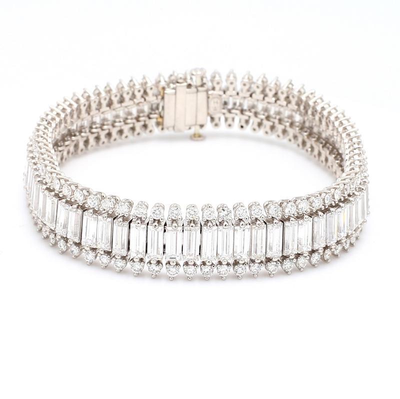Harry Winston, platinum, diamond bracelet. Bracelet is set with sixty-nine ( 69 ) straight baguette cut diamonds and one hundred thirty-eight ( 138 ) round brilliant cut diamonds all weighing approximately 33.00ctw. Bracelet weighs 64.7 grams and