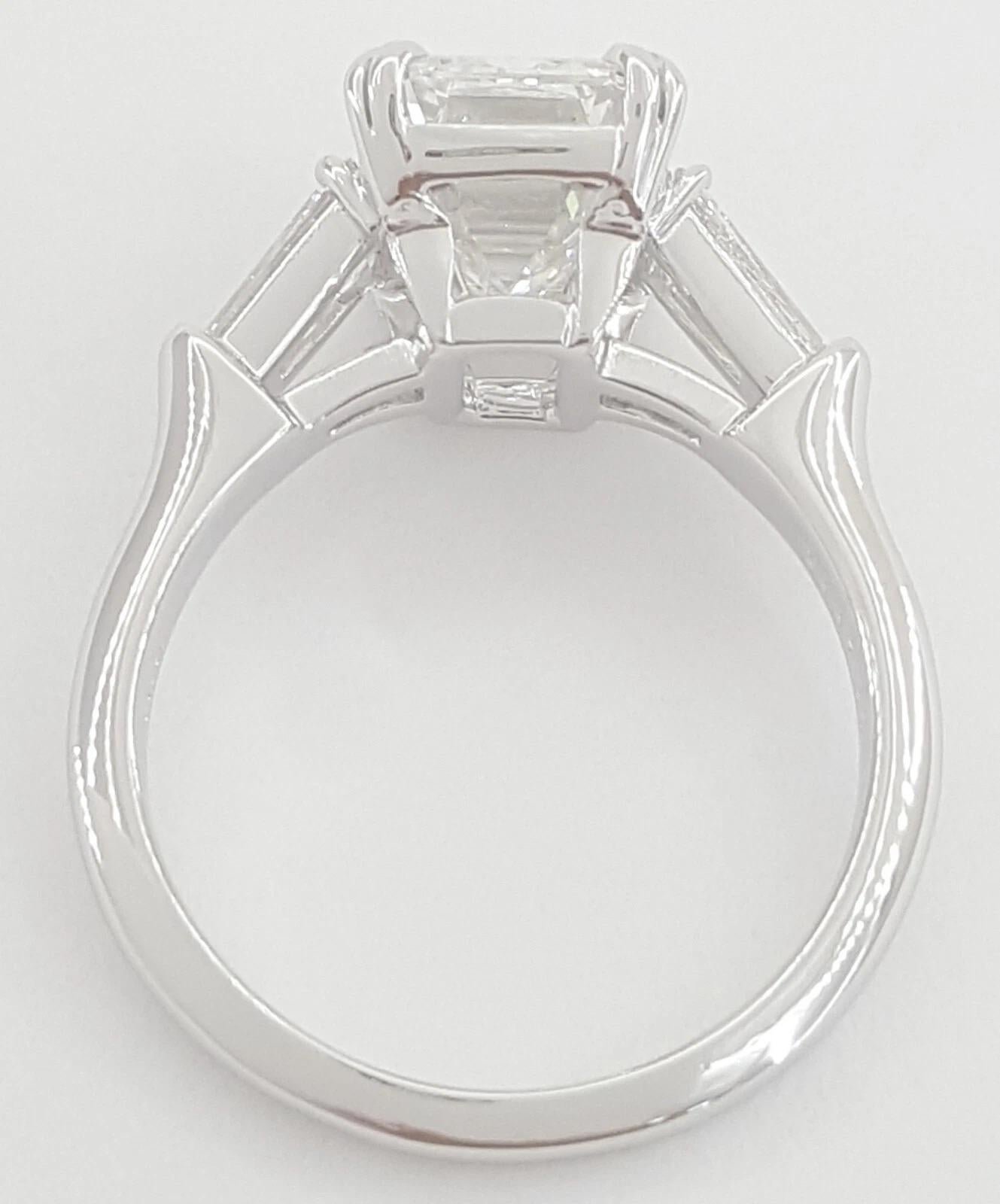 Classic Harry Winston 4.12 ct Total Weight Emerald Cut with Tapered Baguette Diamond Platinum Engagement Ring. 

The ring weighs 7 grams, size 6, the center stone is a 3.56 ct Natural Emerald Cut Diamond, F in color, VVS2 clarity, Excellent Cut,