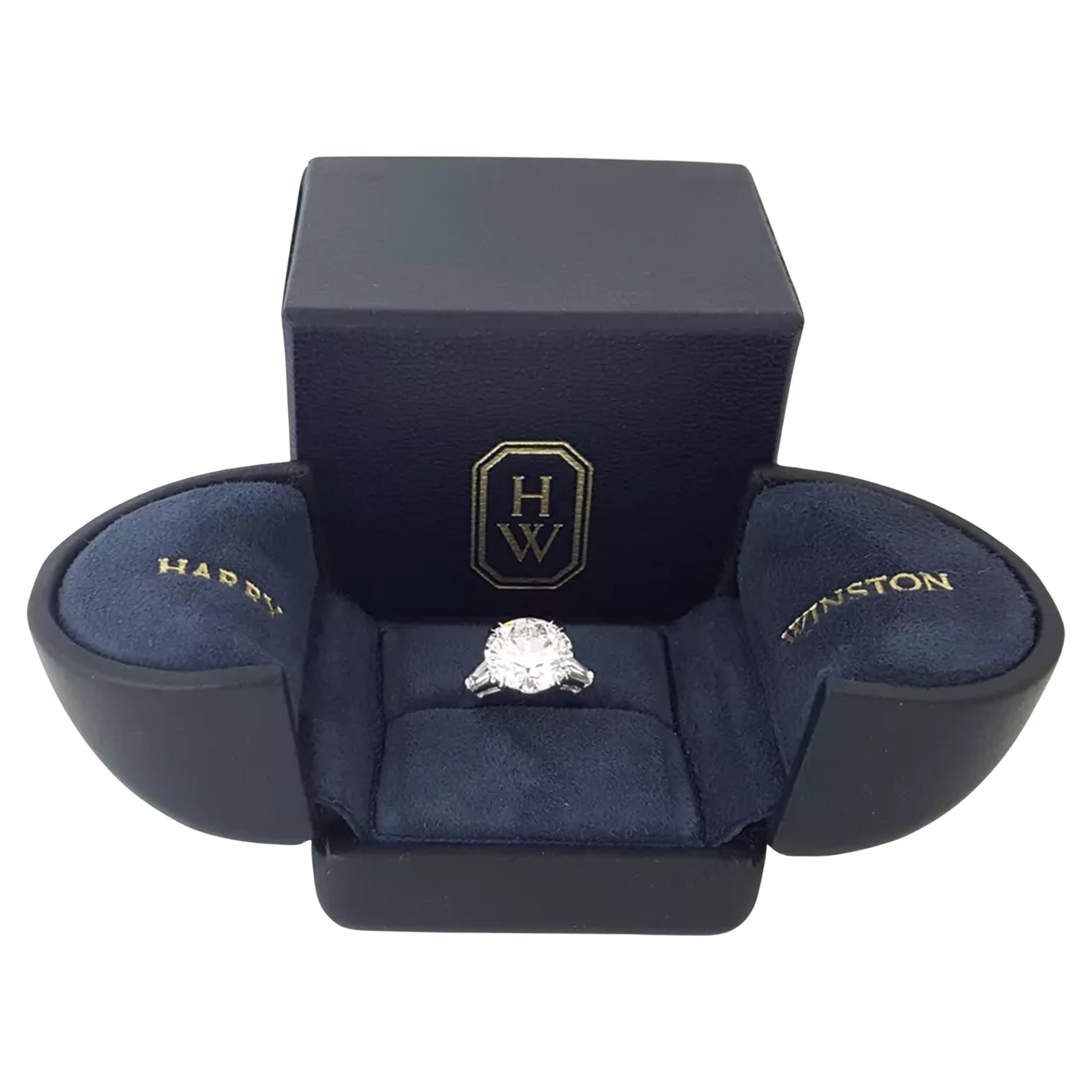 This Harry Winston Platinum Engagement Ring features a total diamond weight of 4.49 carats, highlighted by a breathtaking 4.03-carat natural round brilliant-cut center diamond. The center stone is F in color, VS2 in clarity, with a Very Good Cut,