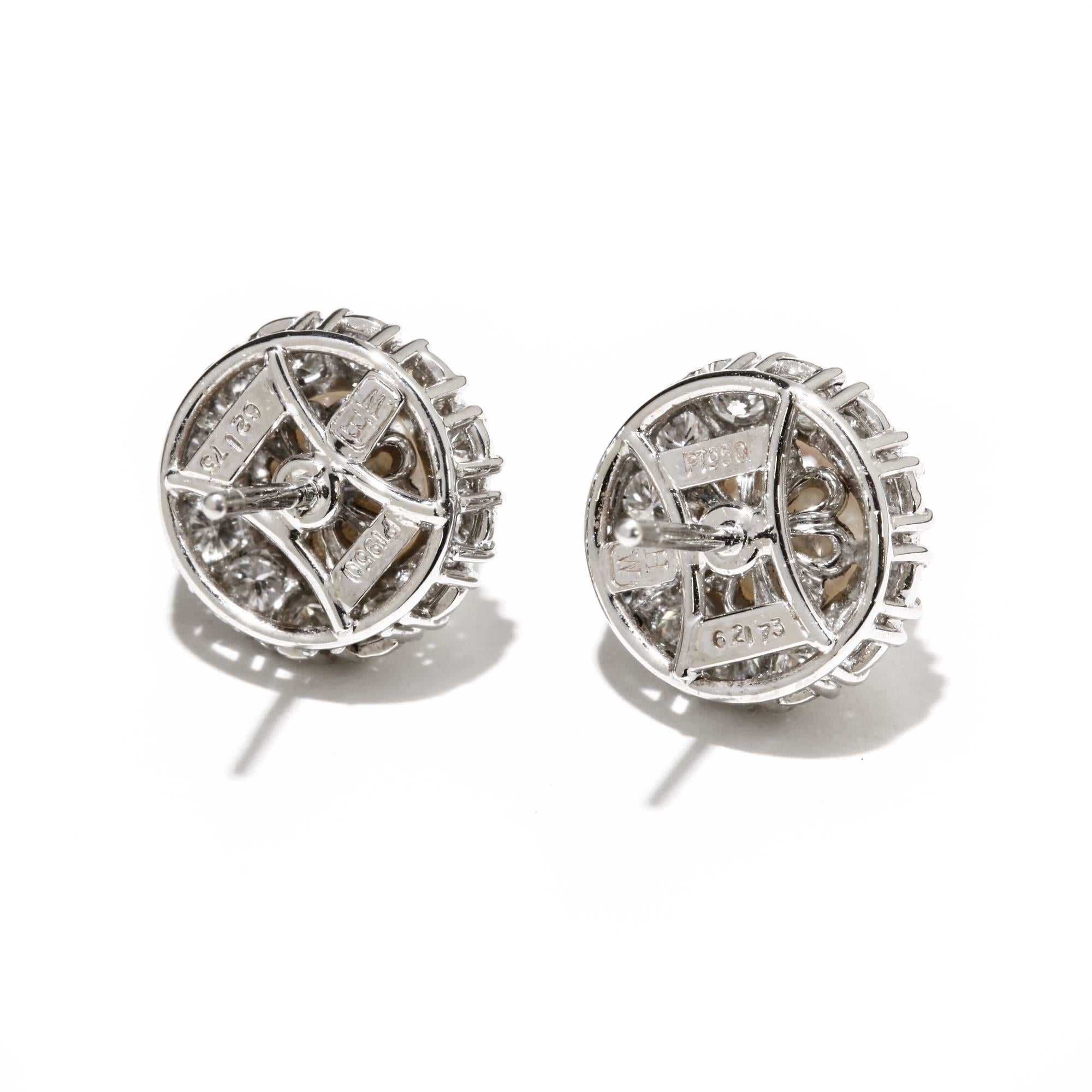 These Harry Winston Akoya pearl and diamond earrings are set in platinum. The earring backs are 18k white gold. The pearls measure 6mm and the total weight of the diamonds is 0.73 ct. Each earring including the diamonds has a diameter of 11mm. The