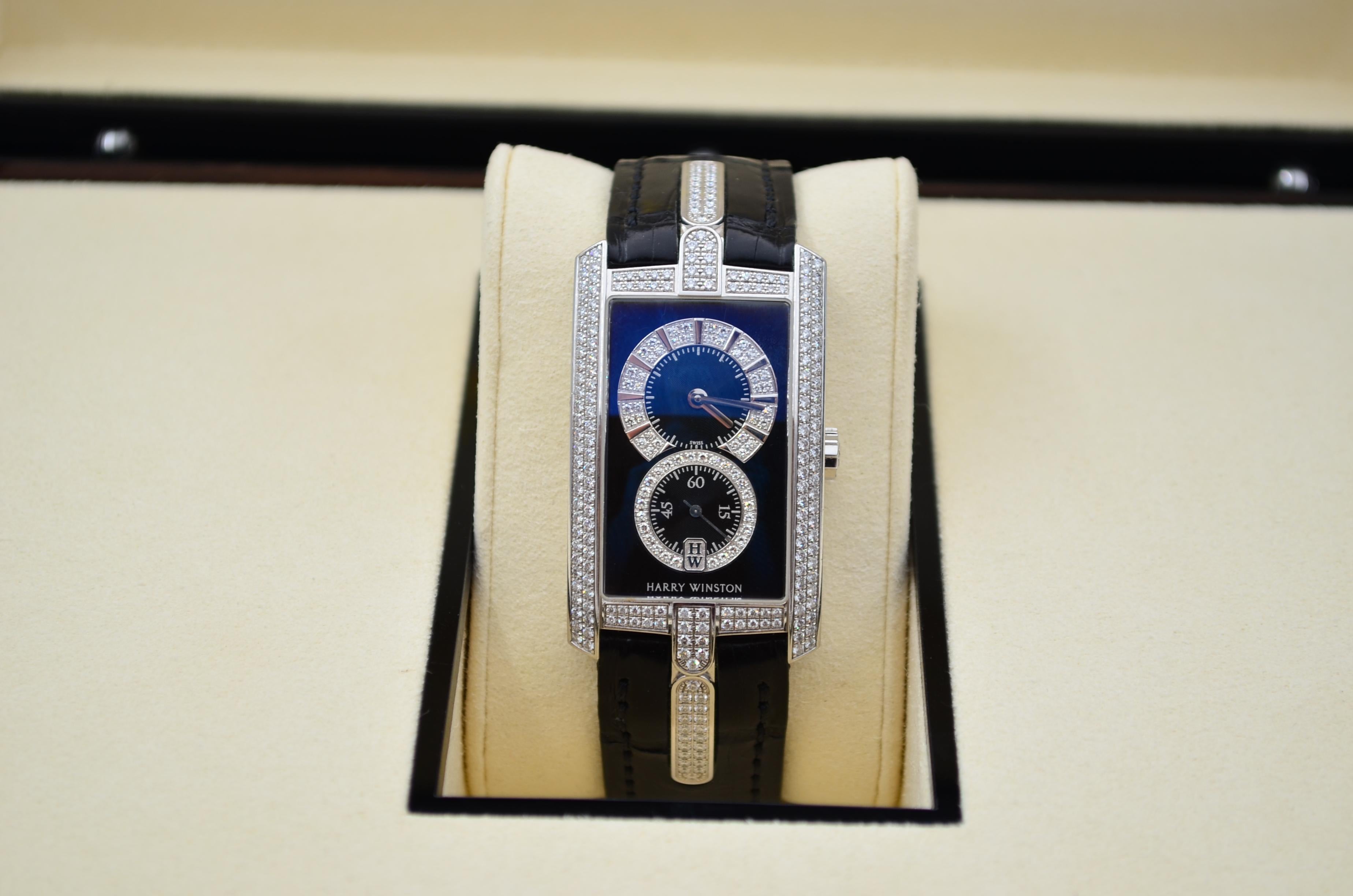 The watch is in a very good condition and it’s working well. It shows slight signs of wear and scratches. The watch comes with an AGS Jewelry wooden box, along with an AGS Jewelry warranty card.  Harry Winston is a prestigious American luxury