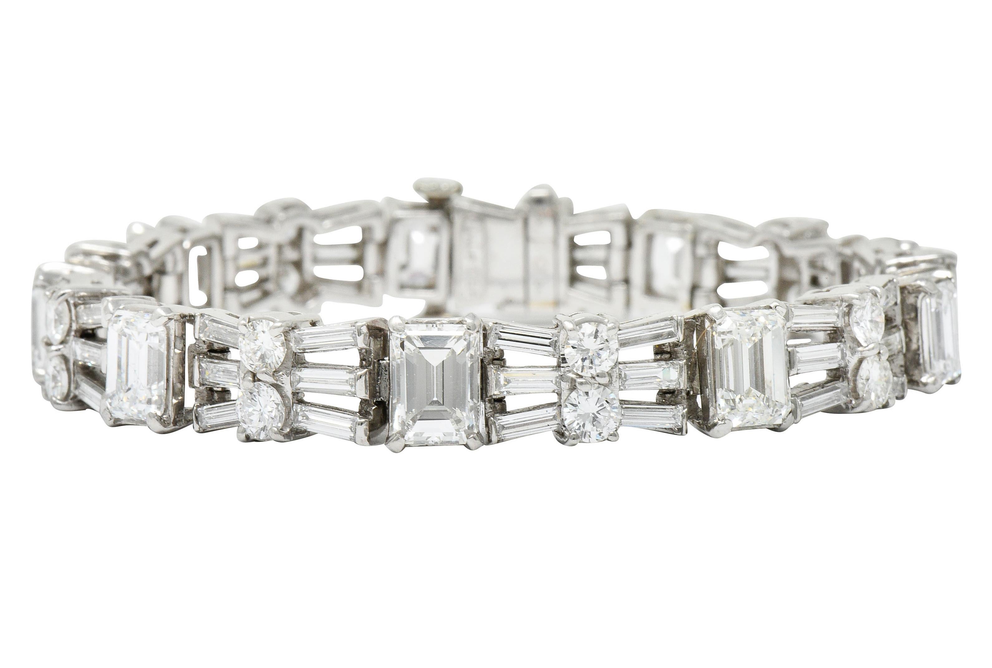 Stylized line bracelet features basket set emerald cut diamonds weighing in total approximately 9.90 carats

Alternating with stylized bow motif links comprised of baguette cut and round brilliant cut diamonds

Baguette cut diamonds weigh
