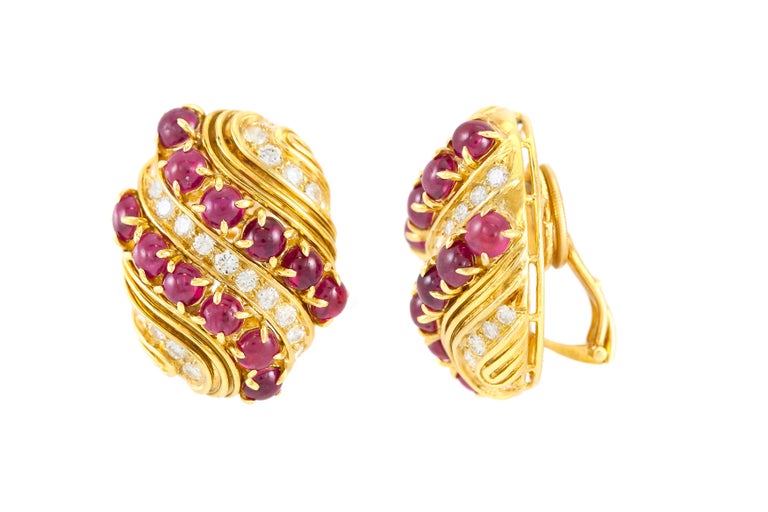 Finely crafted in 18k yellow gold with cabochon rubies weighing a total of 9.34 carats and diamonds weighing a total of 1.74 carats. 
Singed by Harry Winston.
Original papers available
Circa 1980s