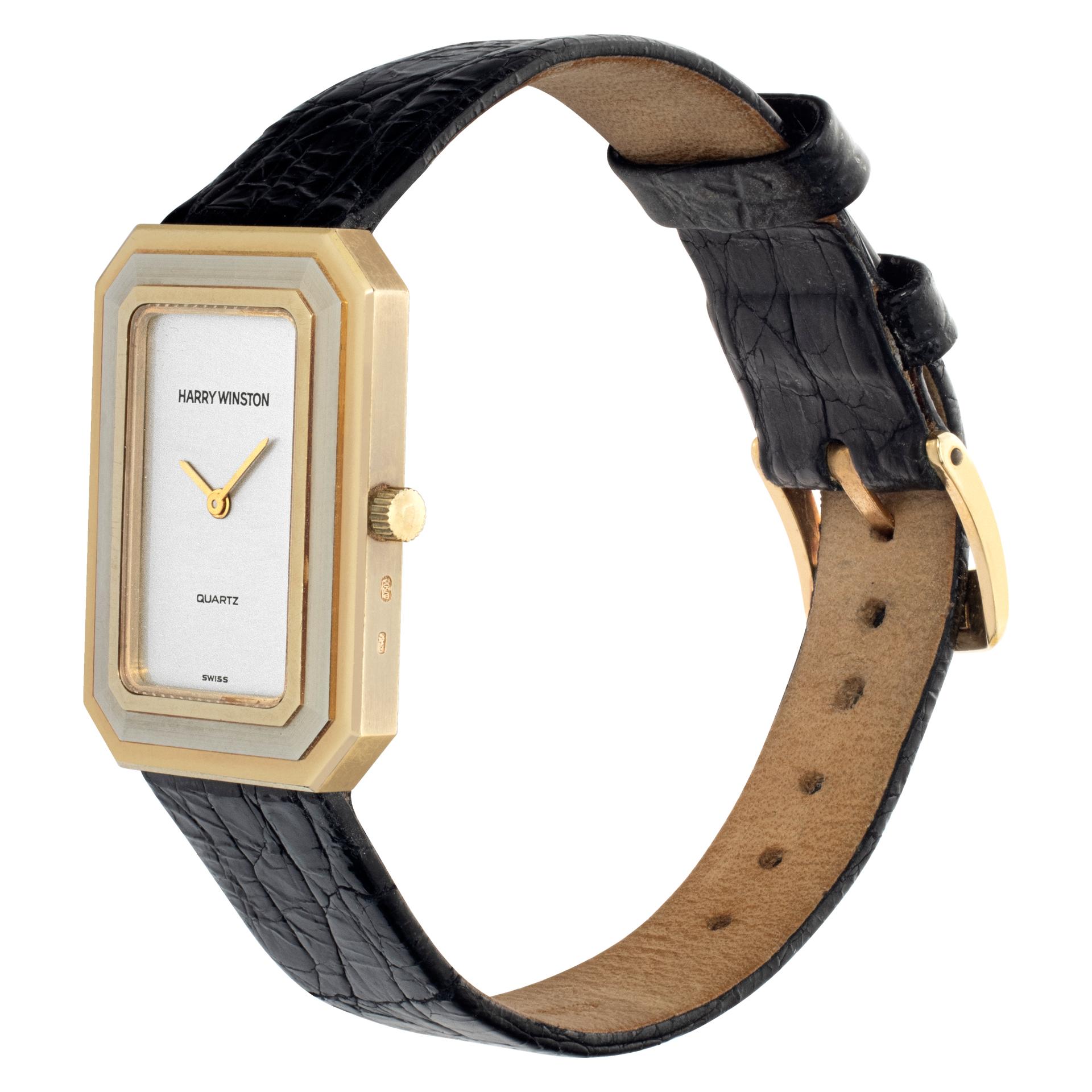 Harry Winston sporty tank wrist watch in yellow and white gold on a black crocodile strap. Yellow gold outer and inner bands frame one of white gold. Quartz. 23 mm case size. Ref 222. Comes with travel pouch. Fine Pre-owned Harry Winston Watch.

