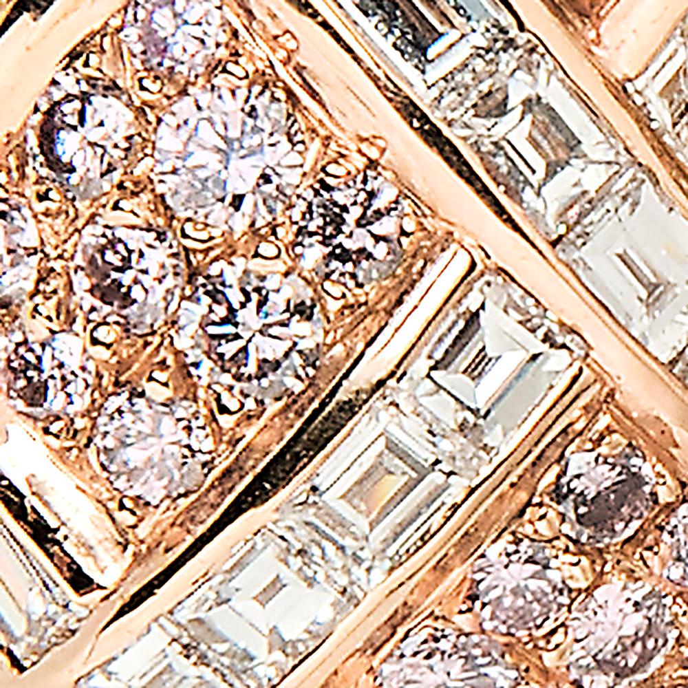 Soft shades of rose gold and delicate hued pink diamonds combine in these graceful earrings. Each is of bombé form set with round pink diamonds crisscrossed by rows of baguette diamonds.

Approximately 0.90” long by 0.47” wide
18k rose gold
80 round