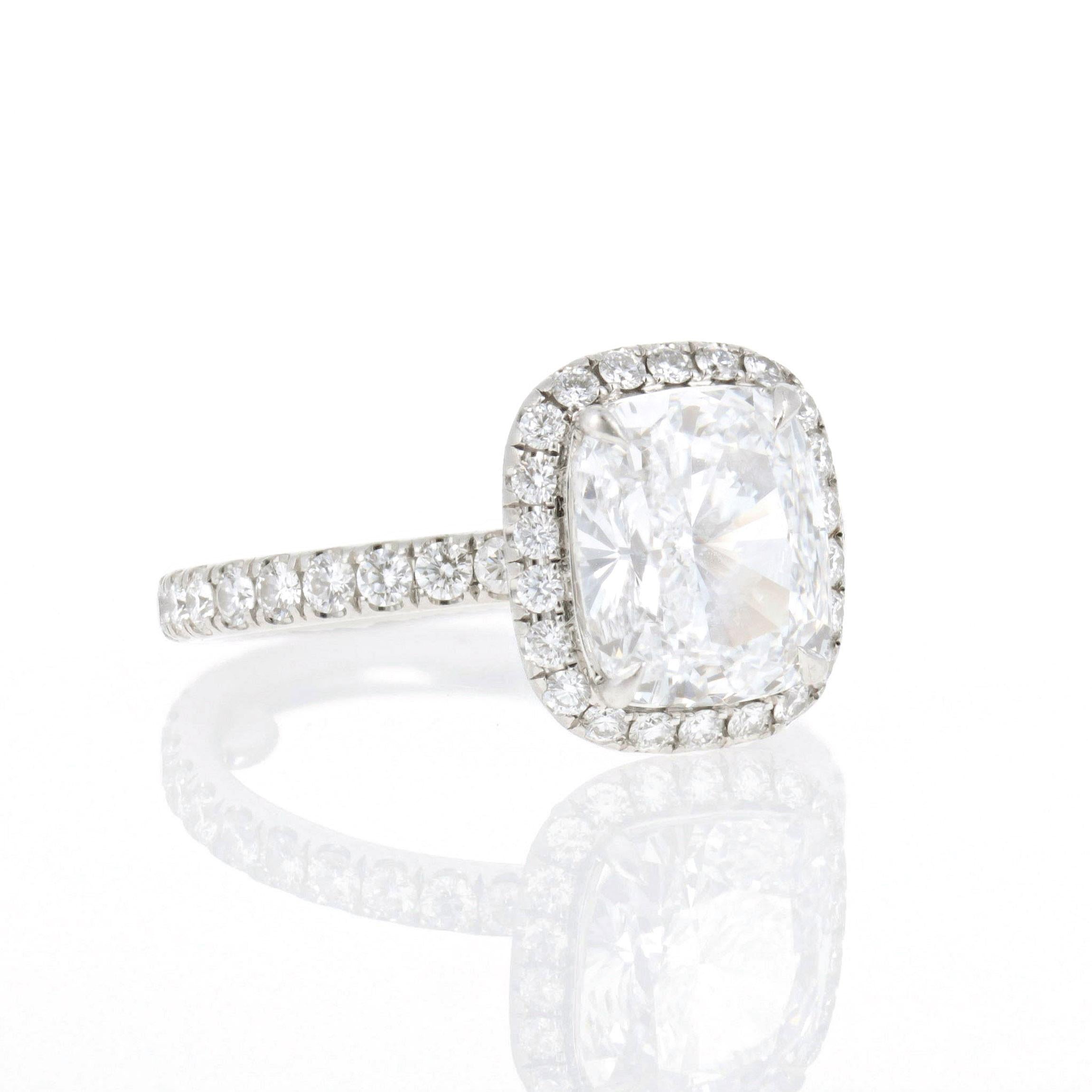 Centering upon a cushion-cut diamond of 2.59 carats, with a diamond-pave platinum mounting. Signed HW for Harry Winston and serial number 267225. With report no. 16768414 dated September 5, 2012, from GIA stating that the diamond is D color and VVS1