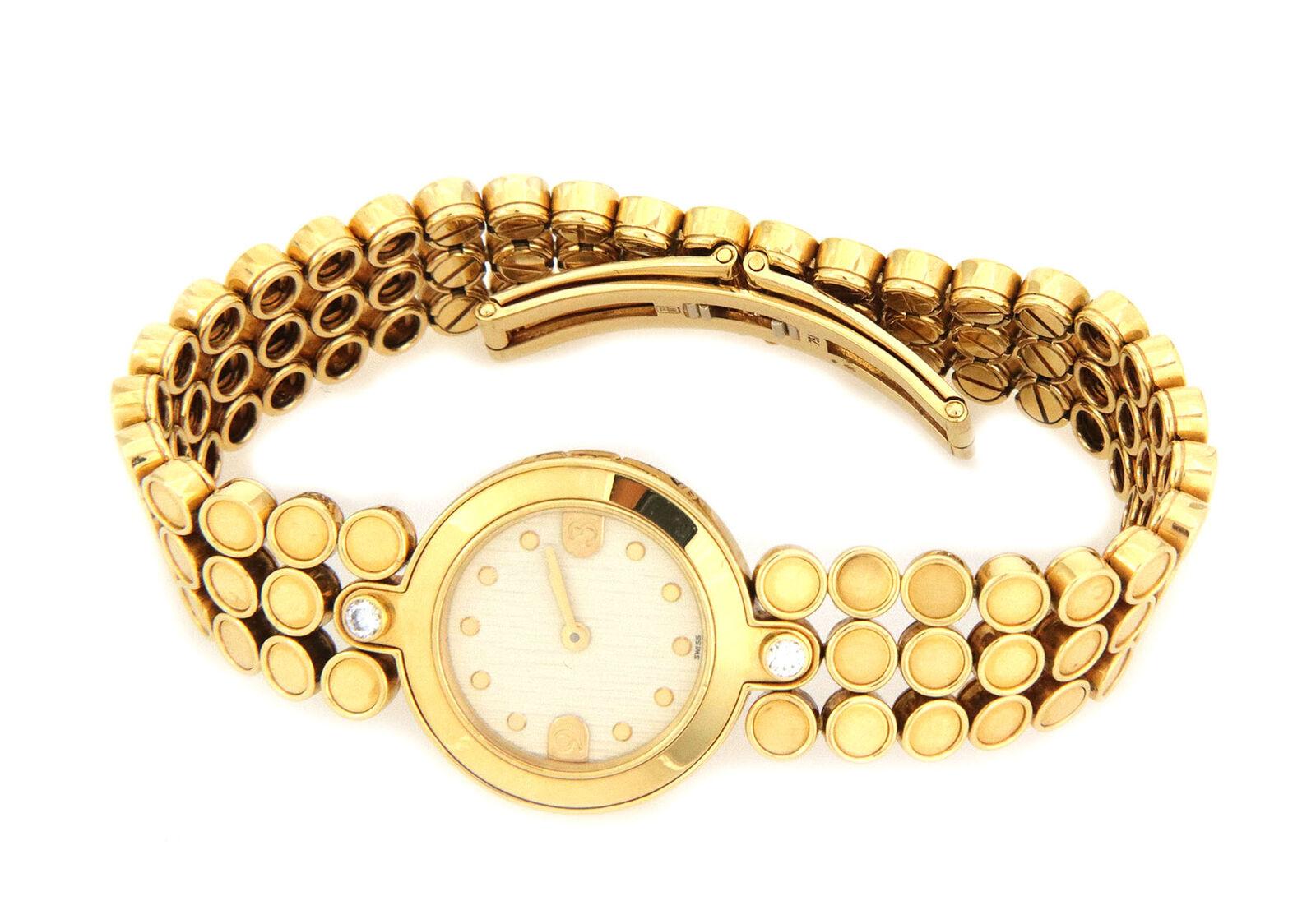 This is a gorgeous authentic women's watch by Harry Winston, crafted from 18k yellow gold featuring a round face watch, battery quartz Swiss Made with sapphire crystal top, champagne color face with gold dot hour markers. The single lug each is