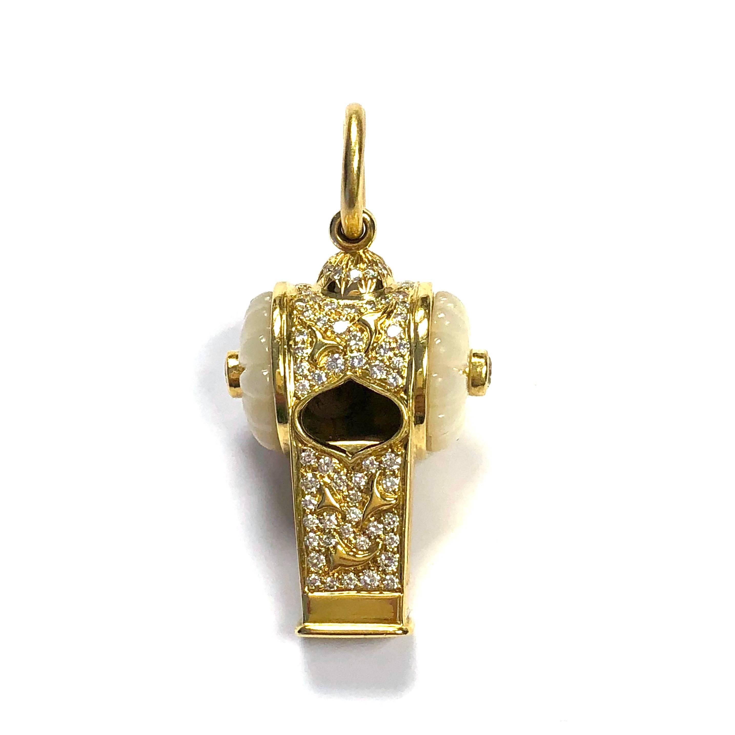 Crafted in 18k gold yellow gold by the famous jewelry house of Harry Winston, this functioning taxi whistle pendant features carved mother-of-pearl sides embellished with bezel set round brilliant cut diamonds  and an elaborate design in gold and