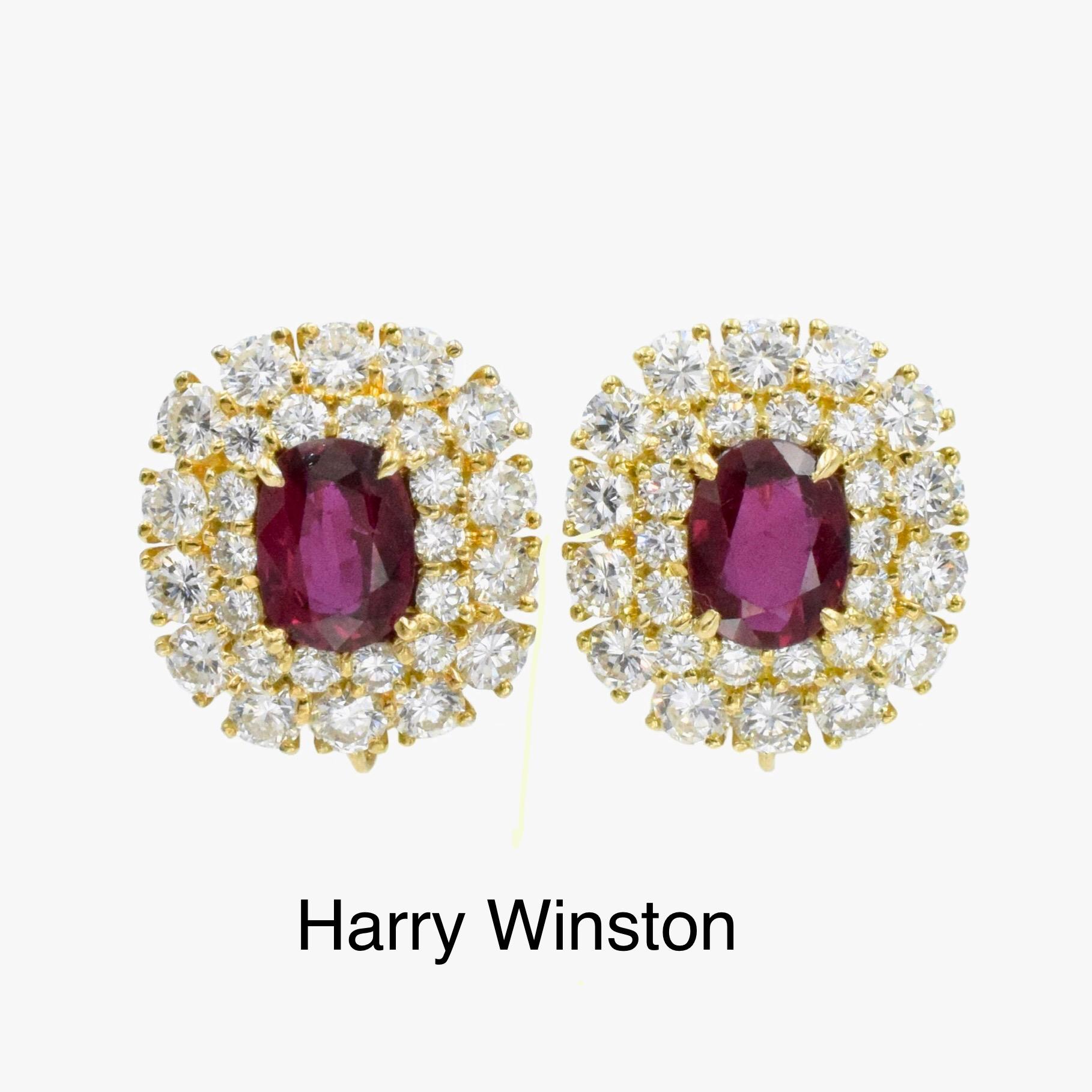 Diamond and Ruby Earrings by Jacques Timey for Harry Winston This pair of
earrings has 2 oval shape rubies weighing a total of approximately 4
carats in the center of 56 round diamonds weighing a total of approximately 6.5 carats all set in 18k