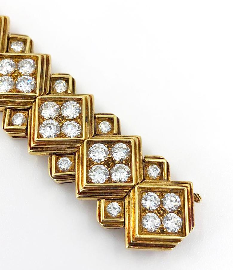 A vintage Harry Winston diamond bracelet in 18k gold; designed as a series of diamond-set square-shaped links with tiered borders, enhanced by smaller similar links, measuring18.0 cm and set with approximately 20 carats of diamonds.

Signed Winston,