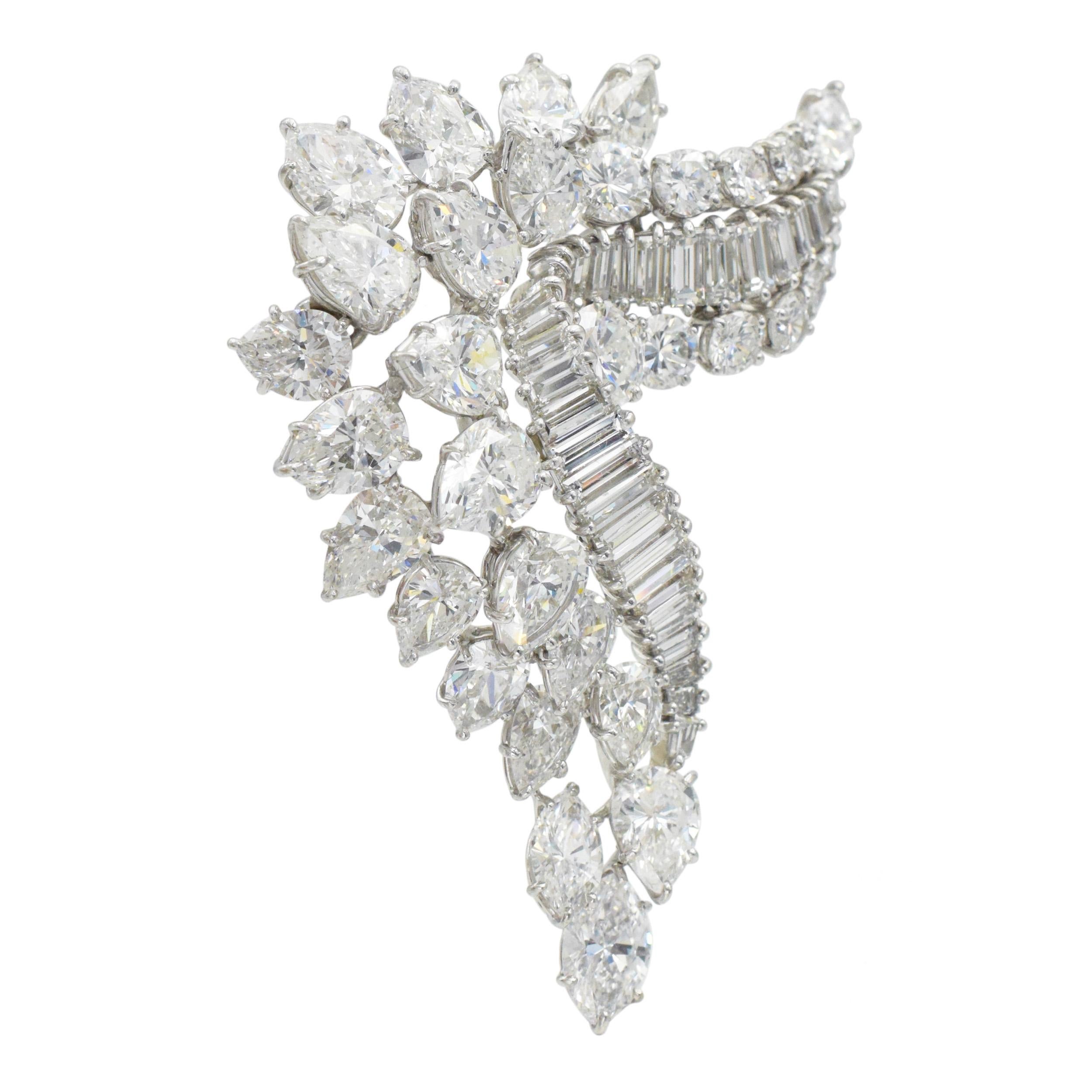 Classic, Harry Winston Diamond Brooch in Platinum. Circa 1965. The brooch is set with 20 pear shape diamonds with total weight of 12.72 carats, 12 round brilliant cut diamonds with total weight of 2.73 carats, 2 marquise cut diamonds with total