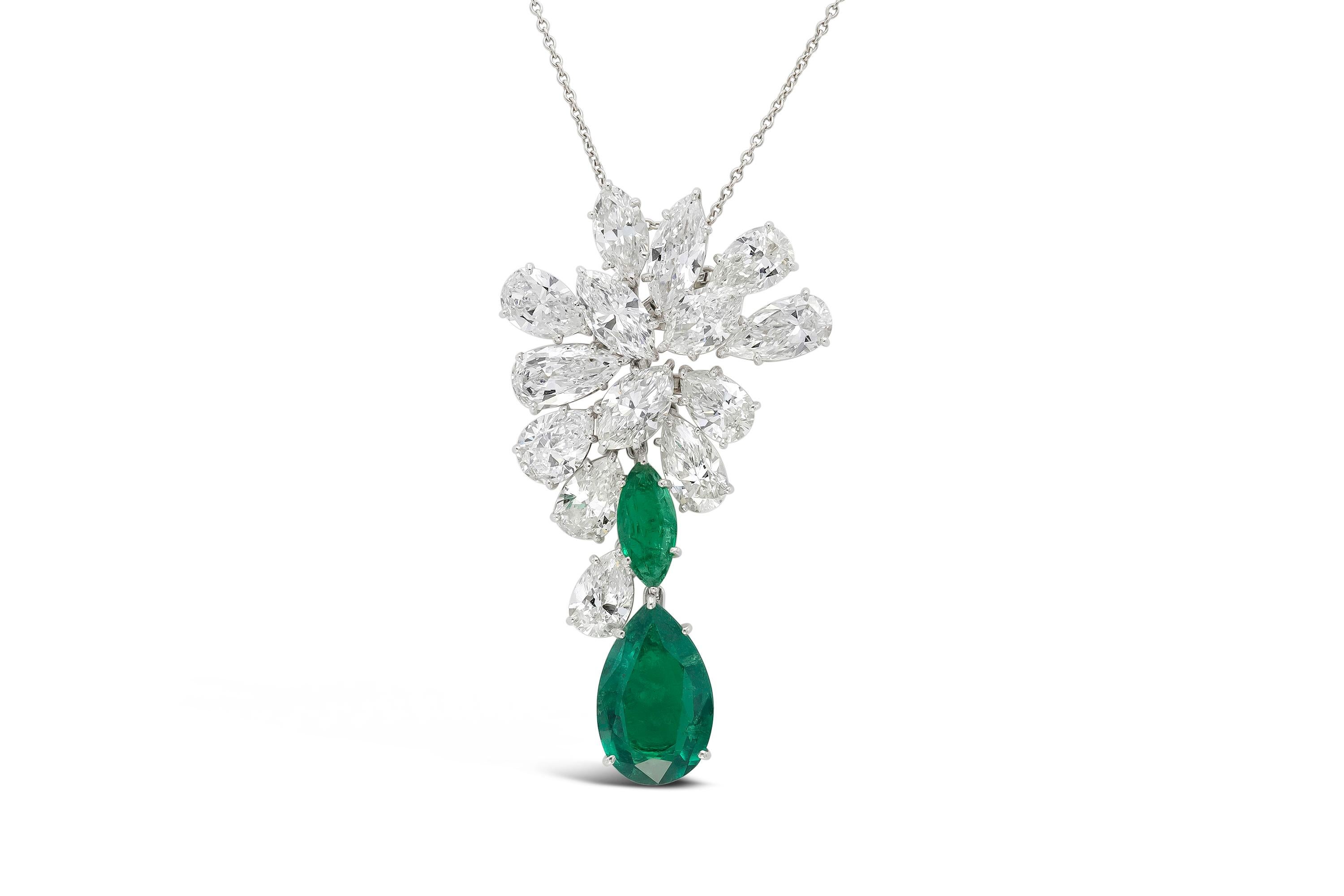 Finely crafted in platinum with Pear Shaped and Marquise cut diamonds weighing a total of 11.31 carats.
The brooch/pendant features a Pear Shaped Colombian Emerald weighing 4.04 carats, and a Marquise cut Colombian Emerald weighing 0.79 carat.
Both