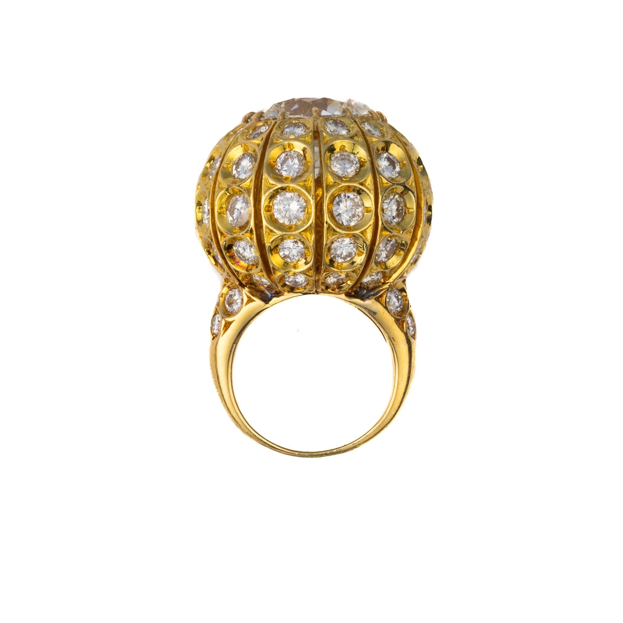 A timeless and extraordinary diamond earrings and ring set by Harry Winston, crafted in 18k yellow gold and dating to 1957. This luxurious set exemplifies mid-20th century jewelry design, showcasing Harry Winston’s signature artistry and commitment
