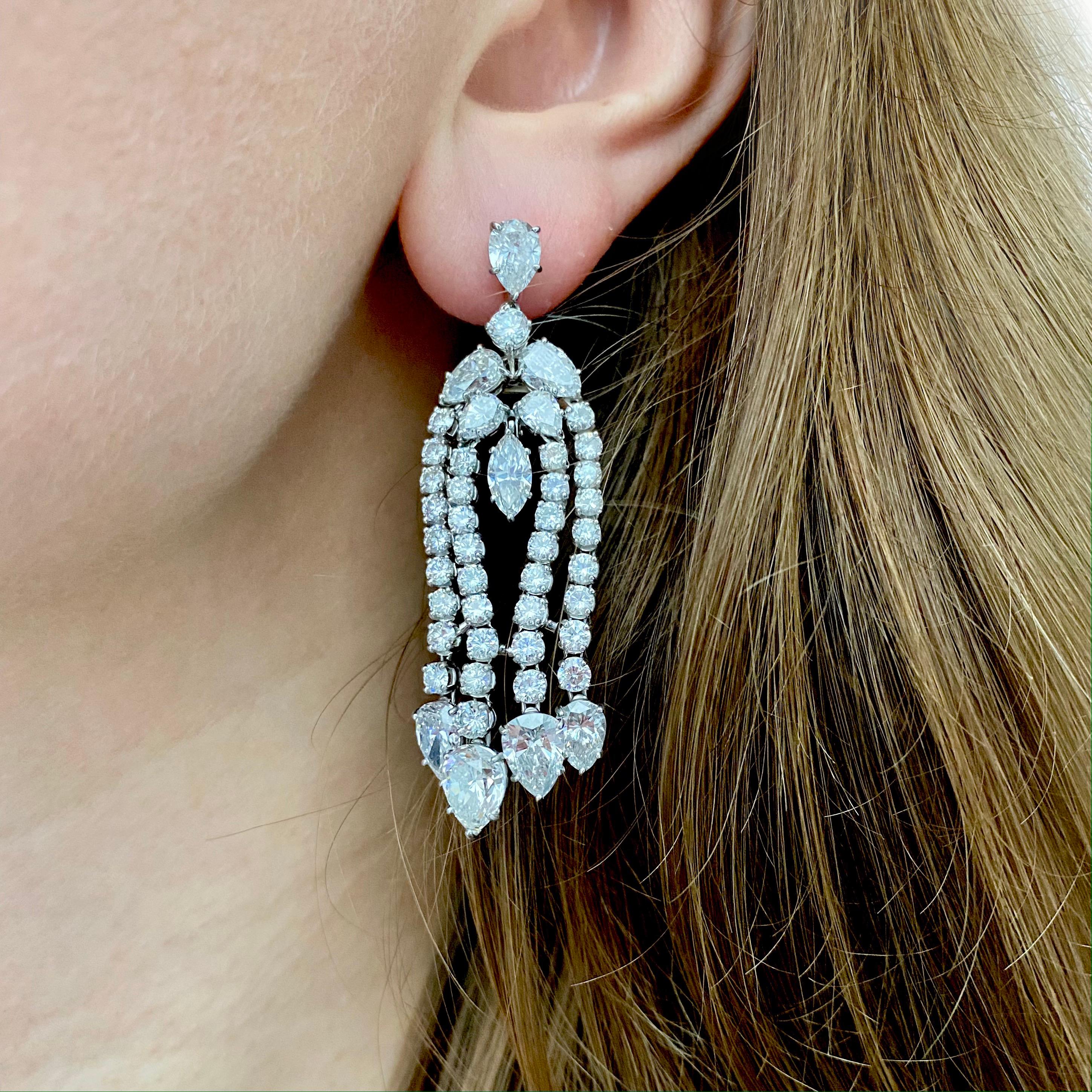 Harry Winston Diamond Chandelier Earrings This pair of chandelier earrings has 90 round,
marquise and pear shaped diamonds weighing 18.50 carats , Color: F/G, Clarity: VS) 
 Platinum with push back post. 
 Signed HW for Harry Winston, PT950; 

