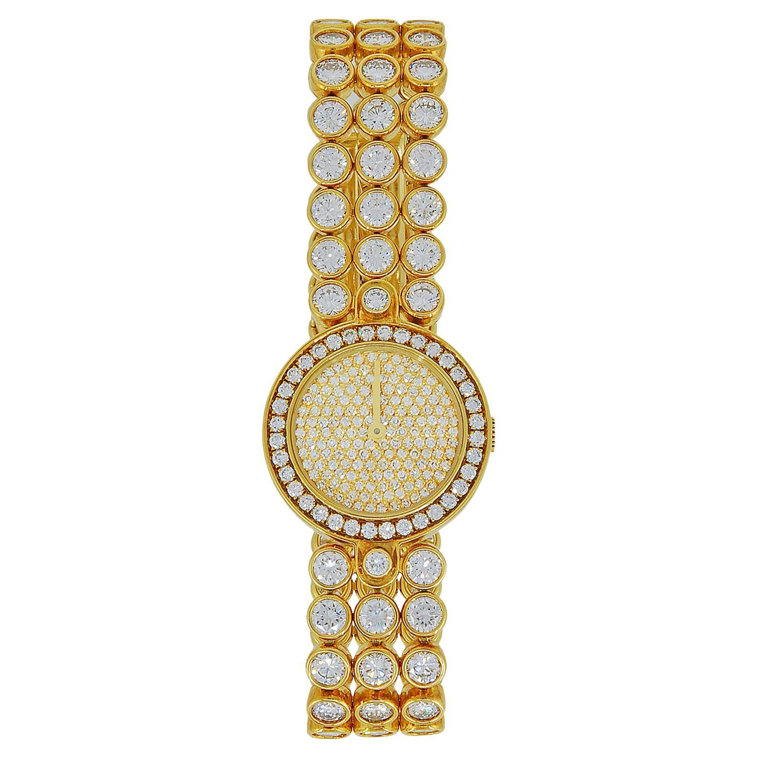 Montre pour dames Harry Winston à trois branches en or et diamants