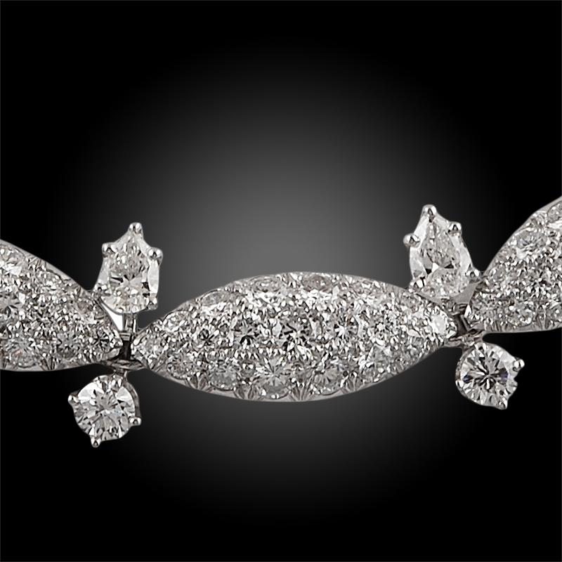 
Harry Winston Diamond Necklace 45 Carats of Diamonds
A vintage Harry Winston piece, glamorously comprised with several pavé's of round brilliant-cut diamonds within marquise motifs, spaced by adjacent pear and round cut diamonds at the ends of each