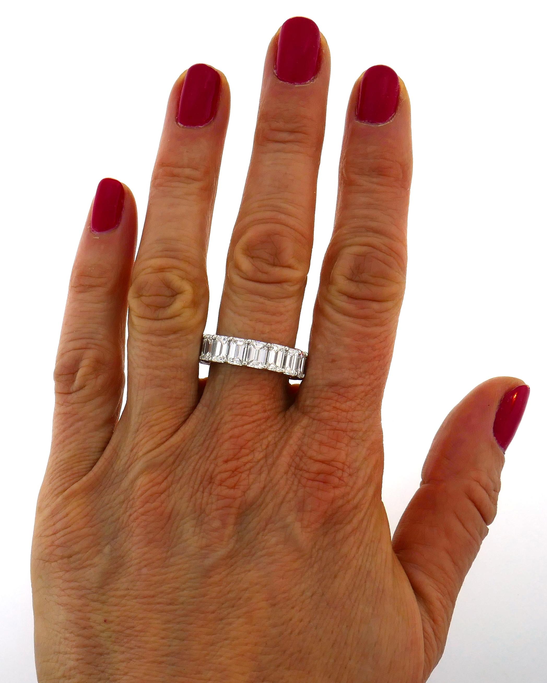  Classy and timeless, stunning diamond eternity band created by Harry Winston. 
Made of platinum and set with eighteen emerald cut diamonds approximately 0.53-carat each. Diamonds are D-F color VVS2 clarity, total weight 9.56 carats. 
Retail price