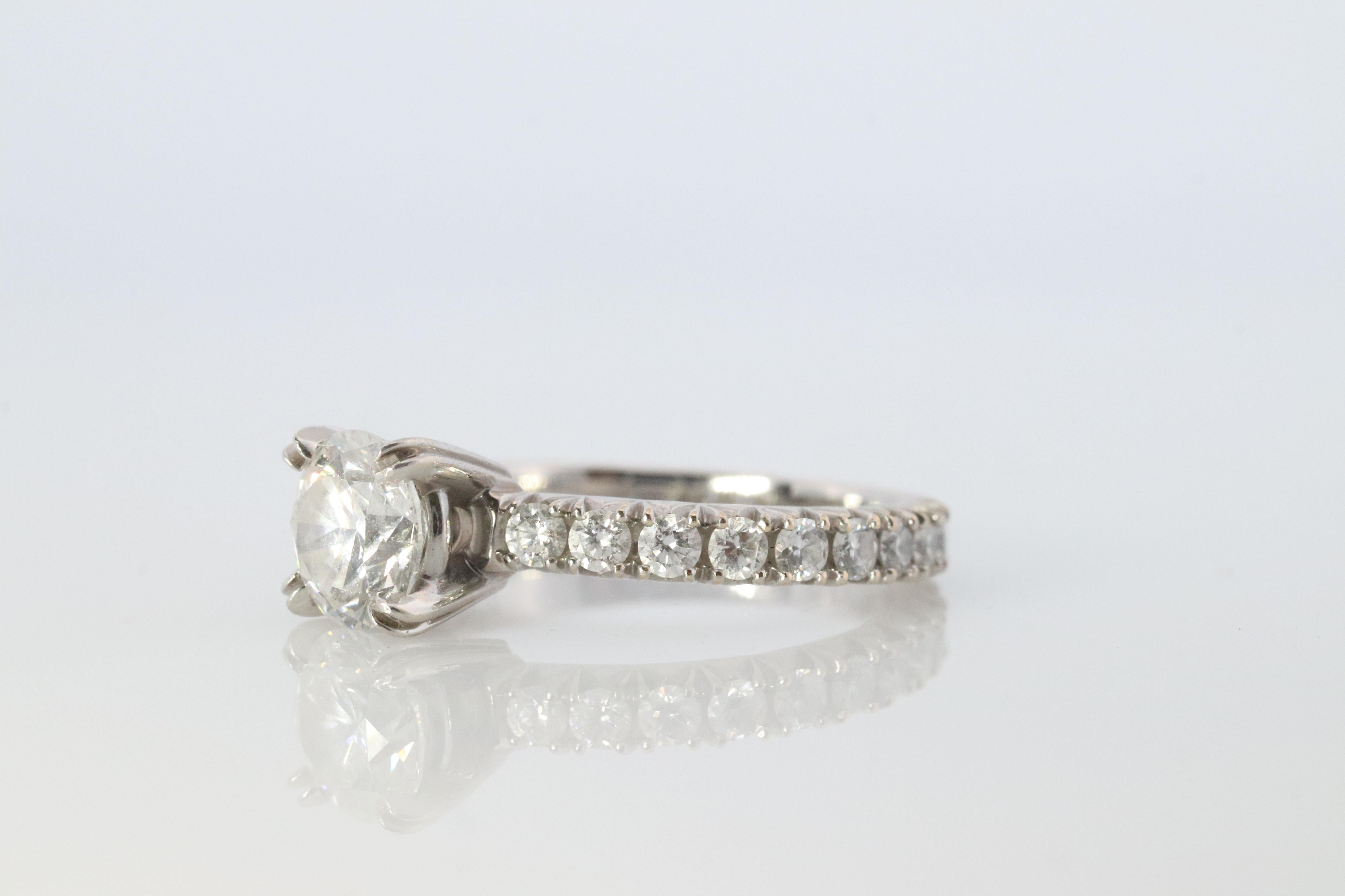 Authentic Harry Winston Ring

Diamond Engagement ring. 

Comfort Fit, with Eternity diamond shank.

PT950 Platinum

0.75ct Brilliant round Cut diamond. VS1 E color
Size 4.5
4.3 grams