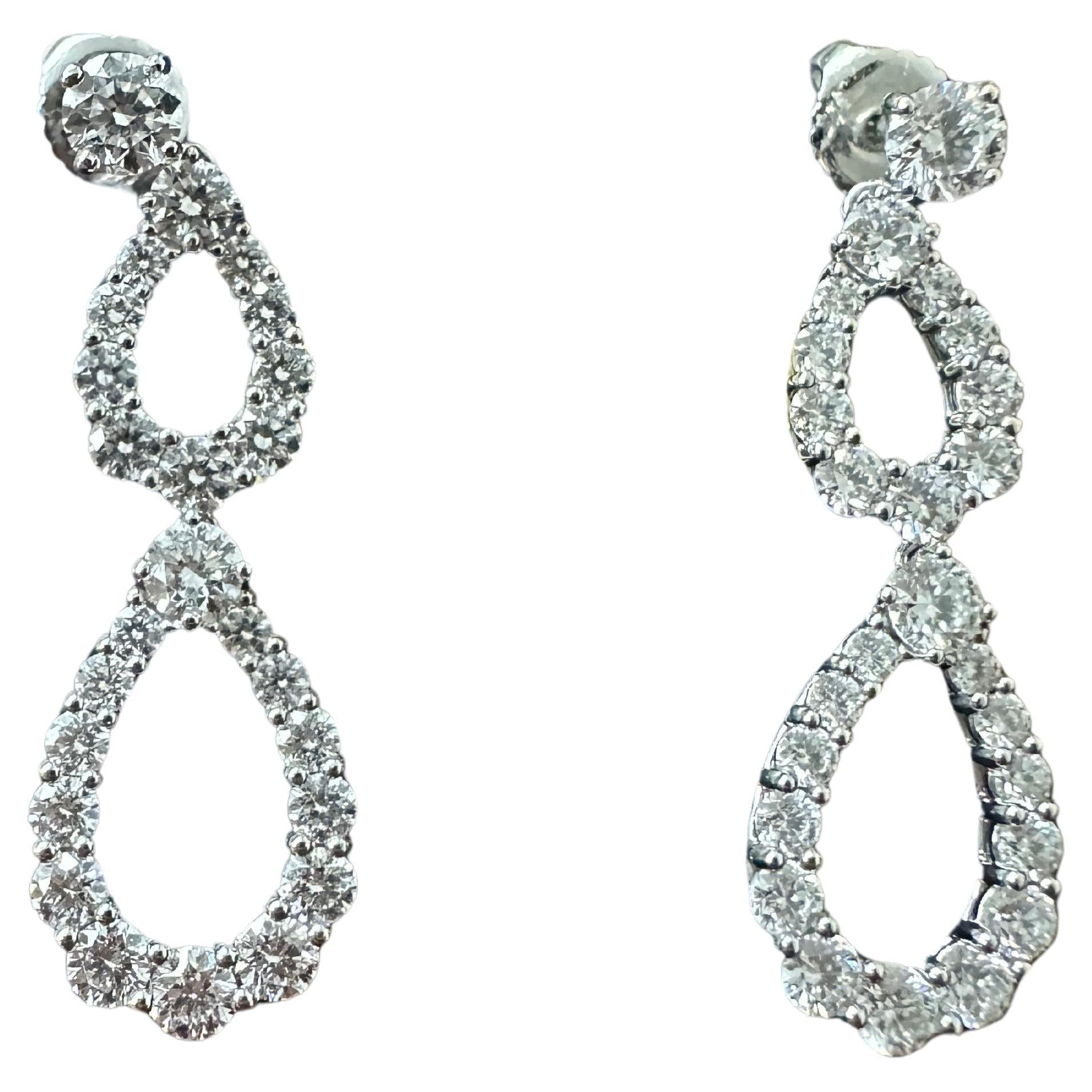 Harry Winston Double Diamond Loop Earrings 
PT950
7,12 gr 
Diamonds are approx. 2.60 cttw, D-F / VS
Length 1 1/4 
Retails for: over $22,400 
Excellent condition , no defects , gently worn 
Come with the original box and service documents from Harry