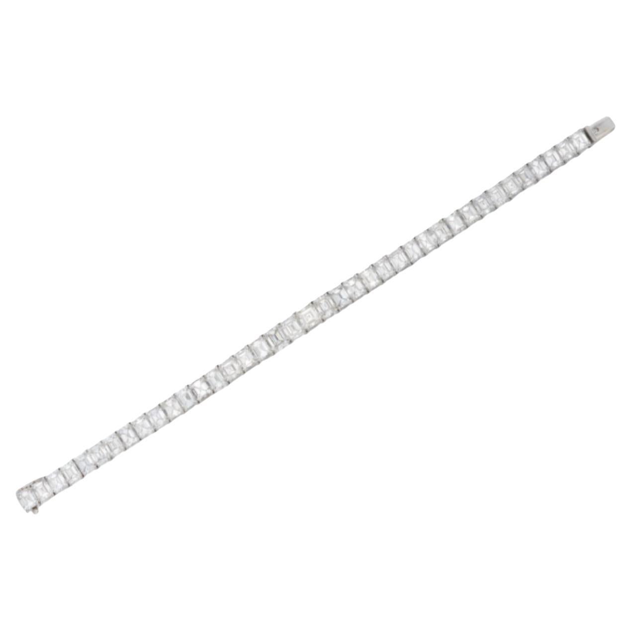 Classic Harry Winston Emerald Cut Diamond Bracelet
This bracelet has 39 emerald cut diamonds weighing a total of 22.12 carats of fine quality diamond (F/G color and  VS clarity) set in platinum shared prong setting. 
Signed and numbered
.Length: 7