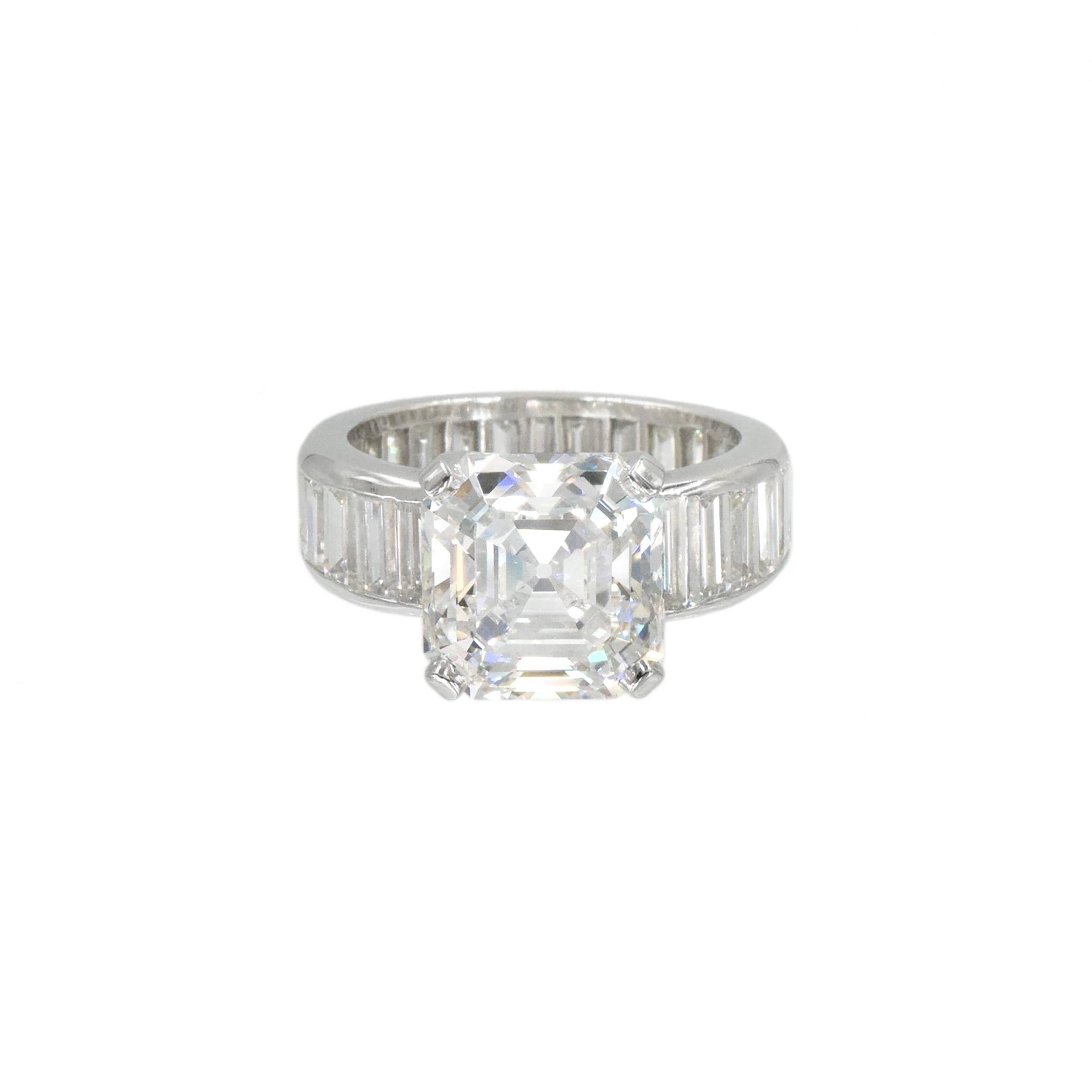 Classic Harry Winston solitaire ring  with a  G.I.A. certified asscher cut center diamond weighs 6.20 carts  Color: E, Clarity: VS1, GIA#6224444094, all set in platinum. This diamond mounting is channel set all the way around with 24 baguette cut
