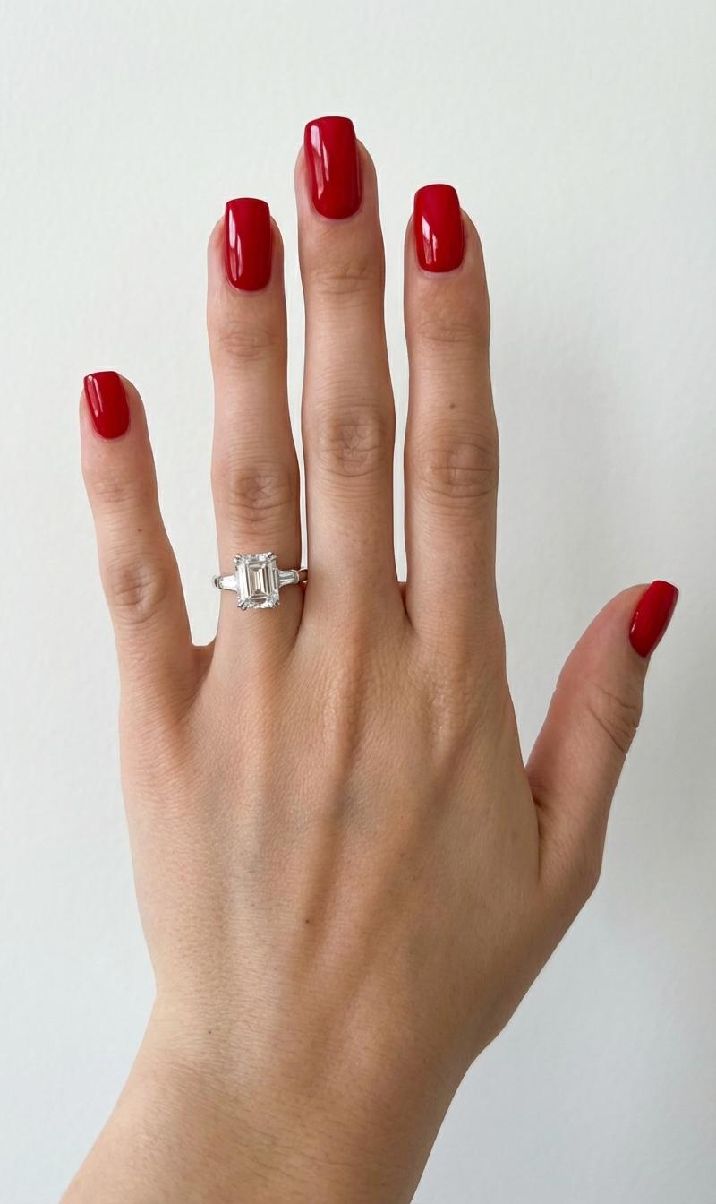 This exceptional Harry Winston engagement ring showcases the house’s legendary artistry and timeless refinement, centered around a magnificent GIA-certified 4.00 carat Emerald Cut natural diamond. Graded F in color and VS1 in clarity, the center