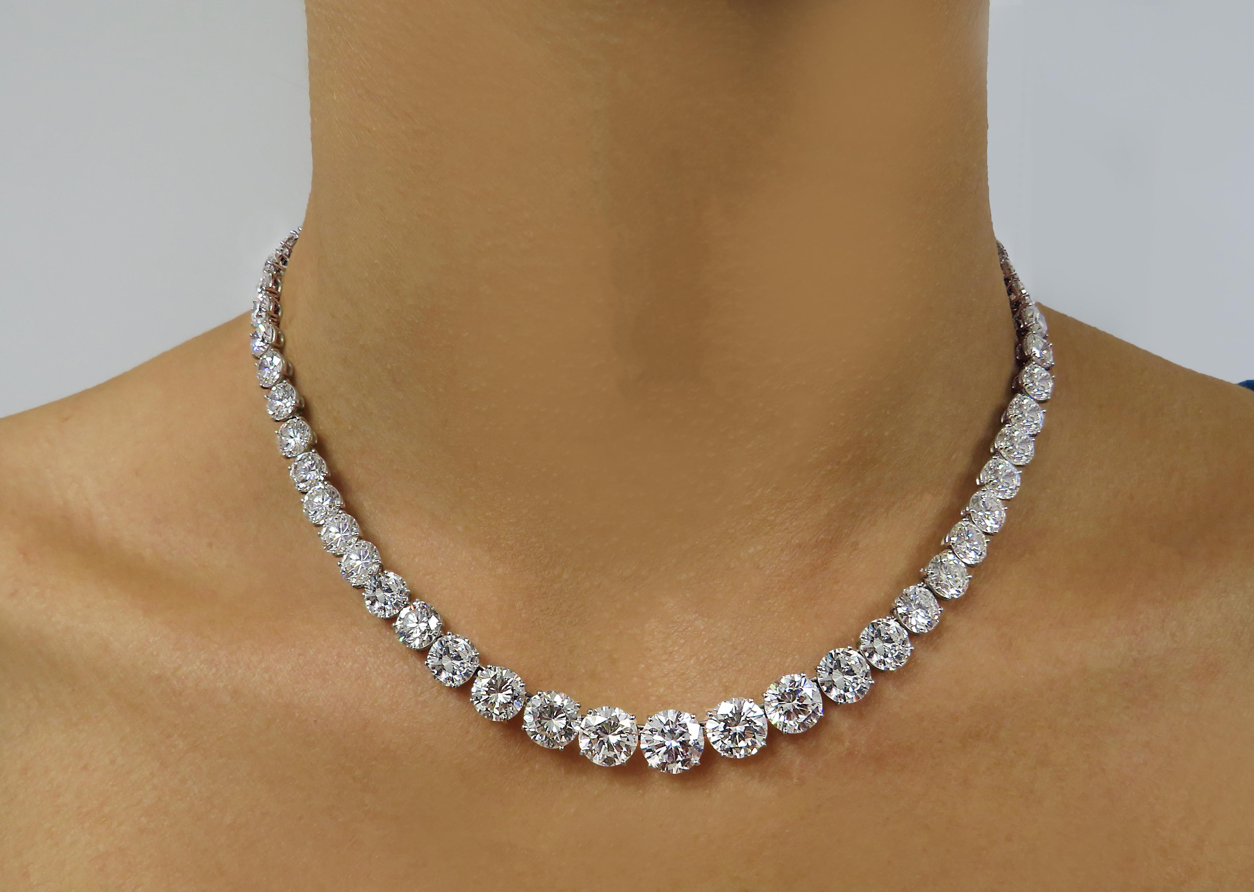 From the legendary House of Harry Winston, this spectacular diamond Riviere necklace, expertly crafted in platinum, showcases 65 sensational round brilliant cut diamonds weighing 44.54 carats total, E-F color, VS clarity. The center 5 diamonds are
