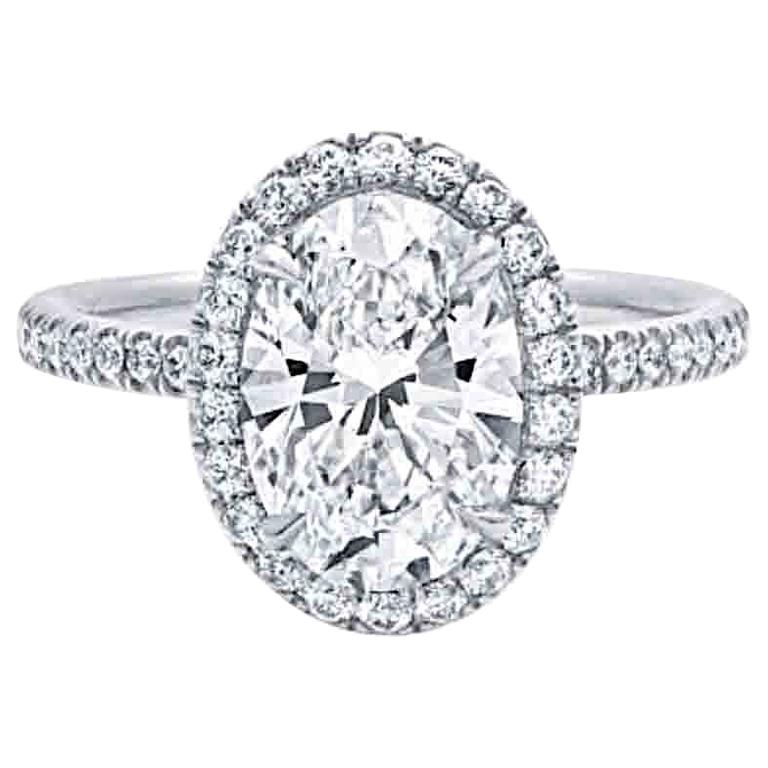 Harry Winston Inspired 1.2 Carat Oval Cut Diamond Halo Engagement Ring For Sale