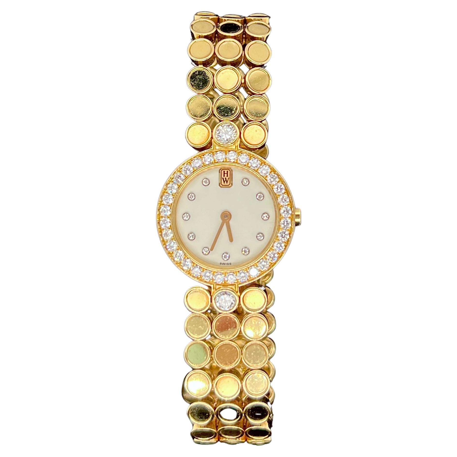 Harry Winston Lady's Watch in 18K Yellow Gold and Diamonds.
