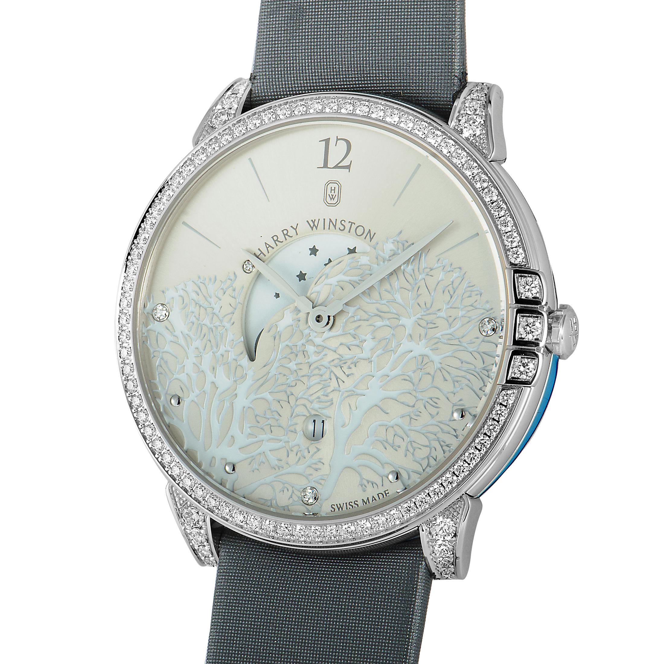 The Harry Winston Midnight Moon Phase, reference number MIDQMP39WW001, is created for the sublime “Midnight” collection.

Presented on a gray satin strap fitted with a tang buckle, the watch comes with a diamond-set 18K white gold case that has a