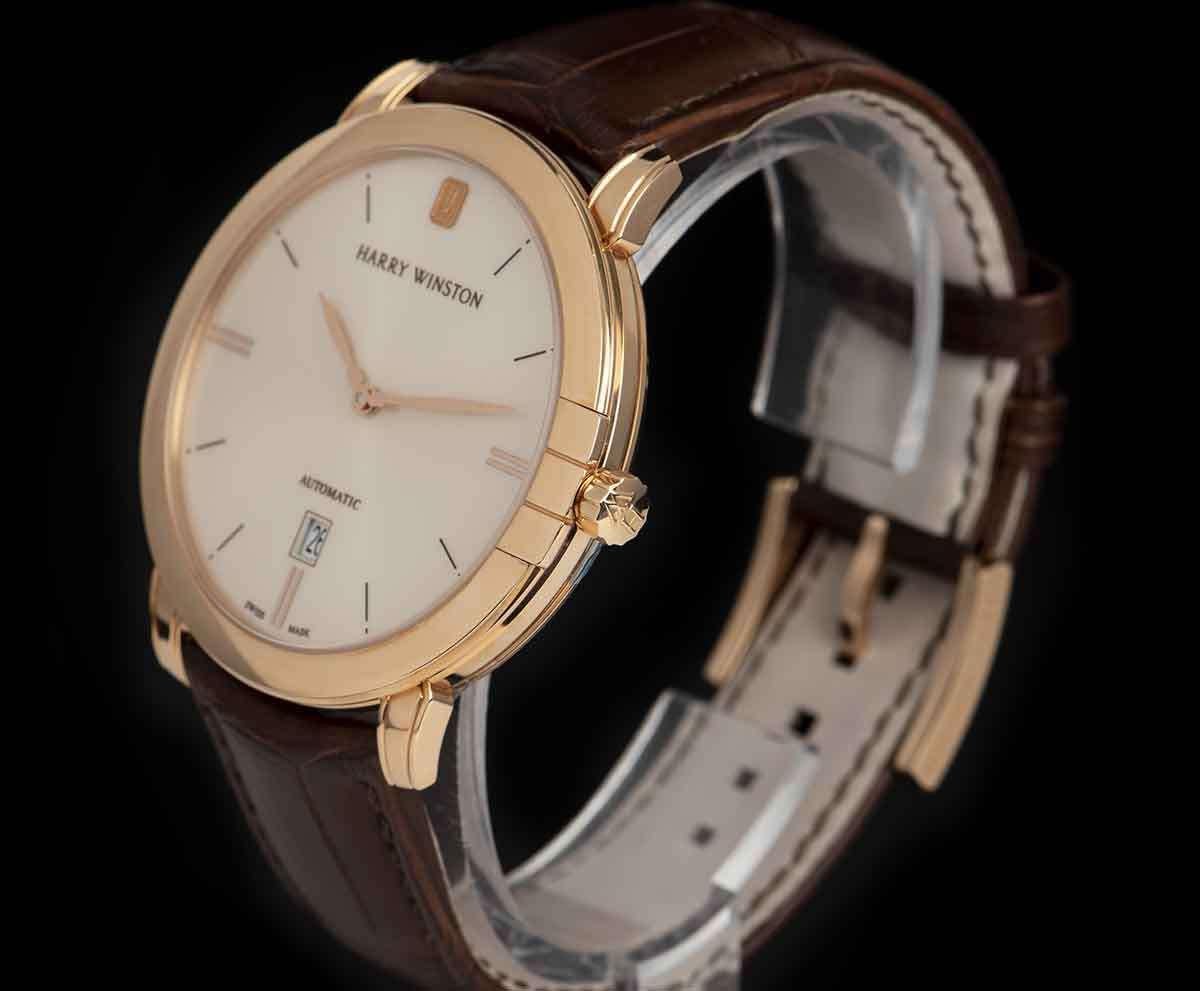 An Unworn 18k Rose Gold Midnight Gents Wristwatch, silver dial with applied index batons, date at 6 0'clock, a fixed 18k rose gold bezel, an original brown leather strap with an original 18k rose pin buckle, sapphire glass, exhibition caseback,