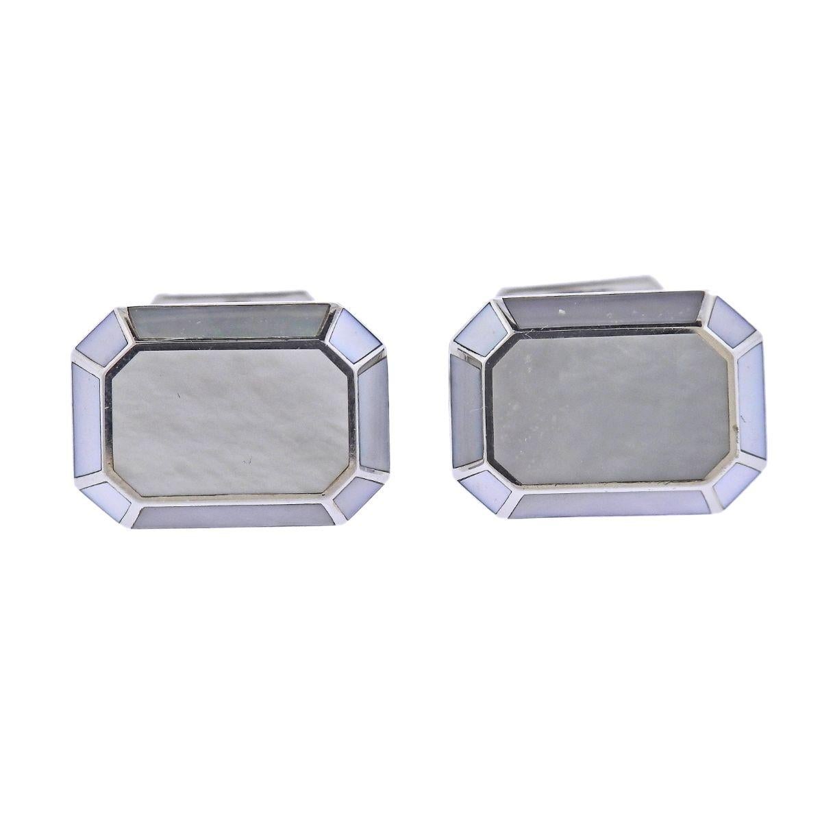 Pair of 18k white gold classic cufflinks by Harry Winston, set with mother of pearl. Cufflink top is 18mm x 13mm. Weigh 17.5 grams. Marked: HW, 750, 139541. Comes in original HW box.